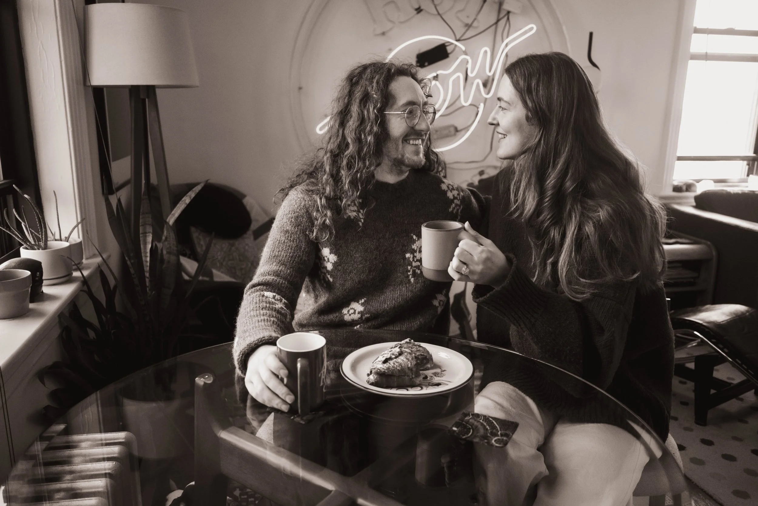 Intimate candid moment of a couple enjoying coffee during a documentary-style engagement session in Brooklyn