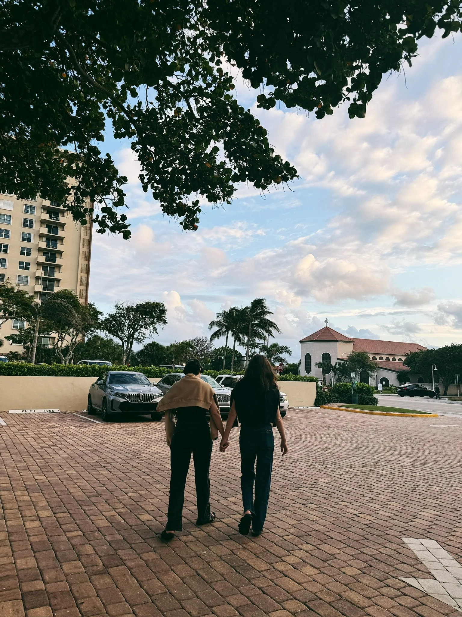 Couple walks hand in hand photographed using an iPhone