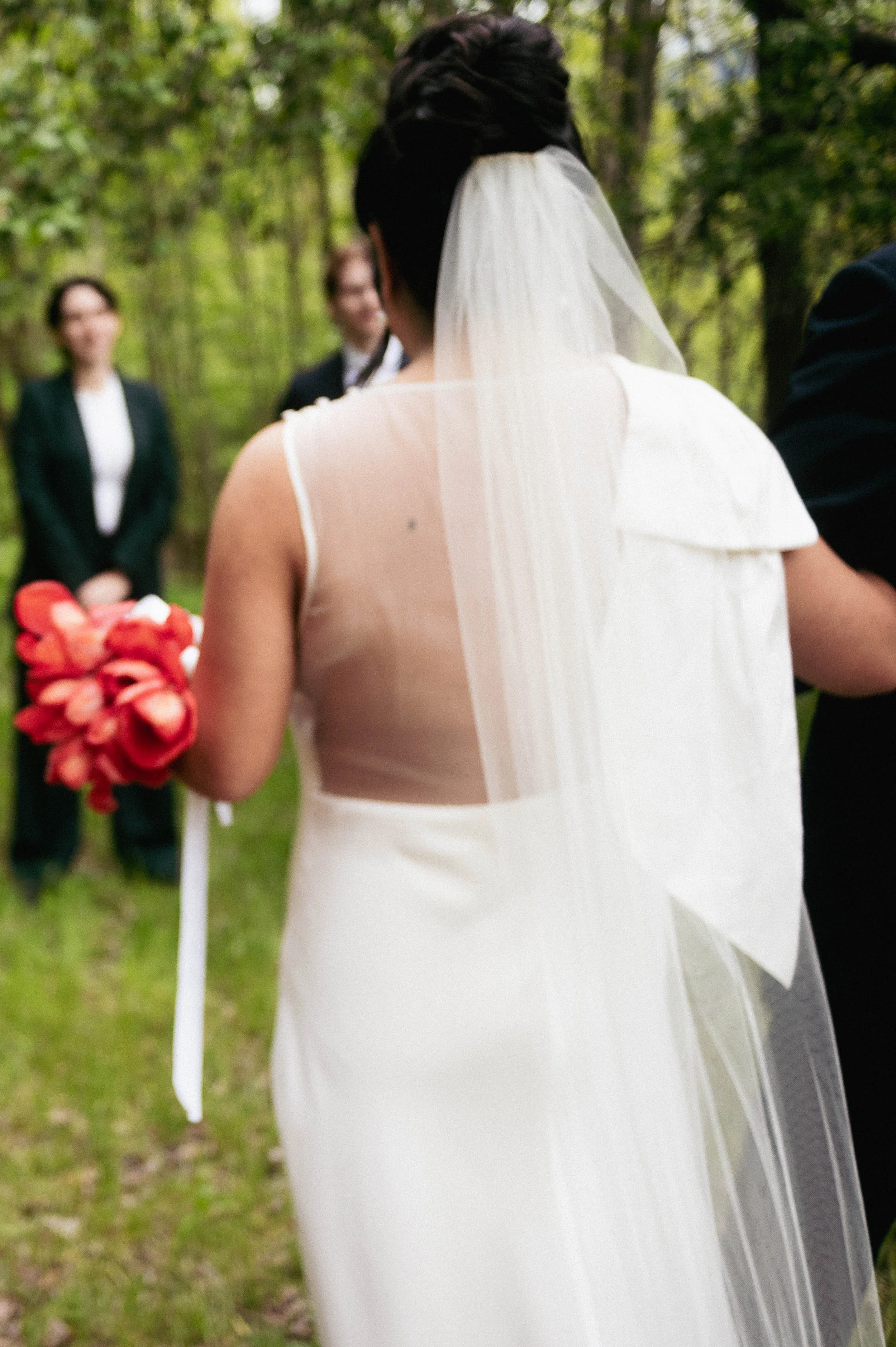 Bride walking down the aisle at an outdoor wedding ceremony in upstate New York