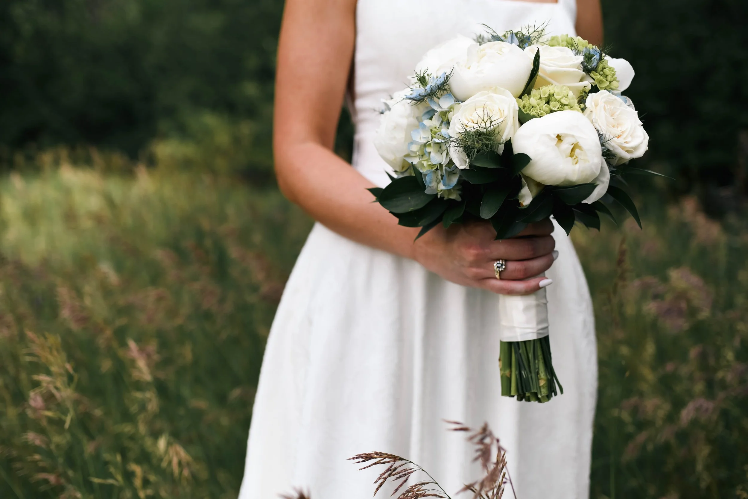 Detail shot of wedding rings and flowers at an Albuquerque New Mexico wedding