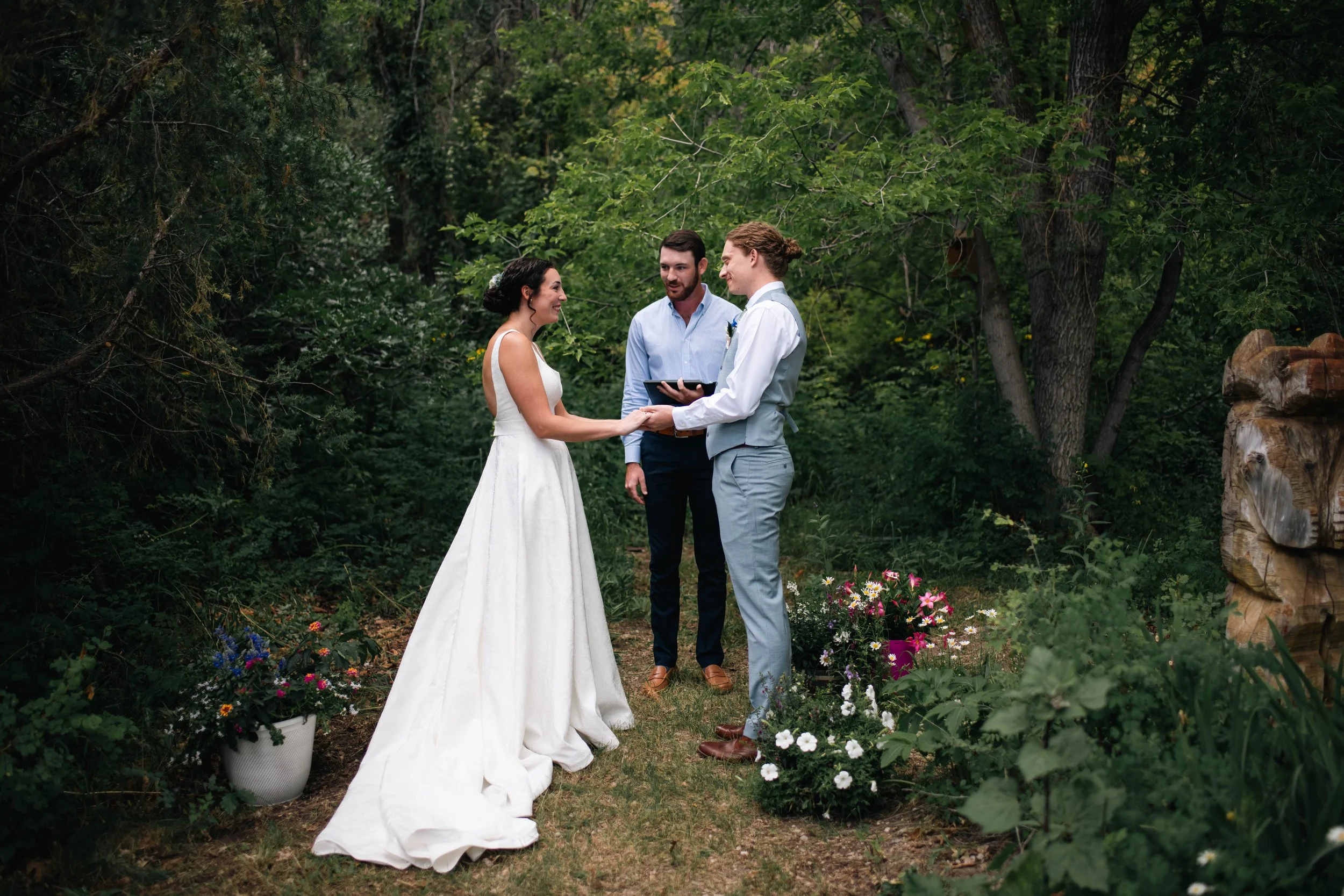 Couple exchanging vows during their outdoor wedding ceremony in Albuquerque New Mexico