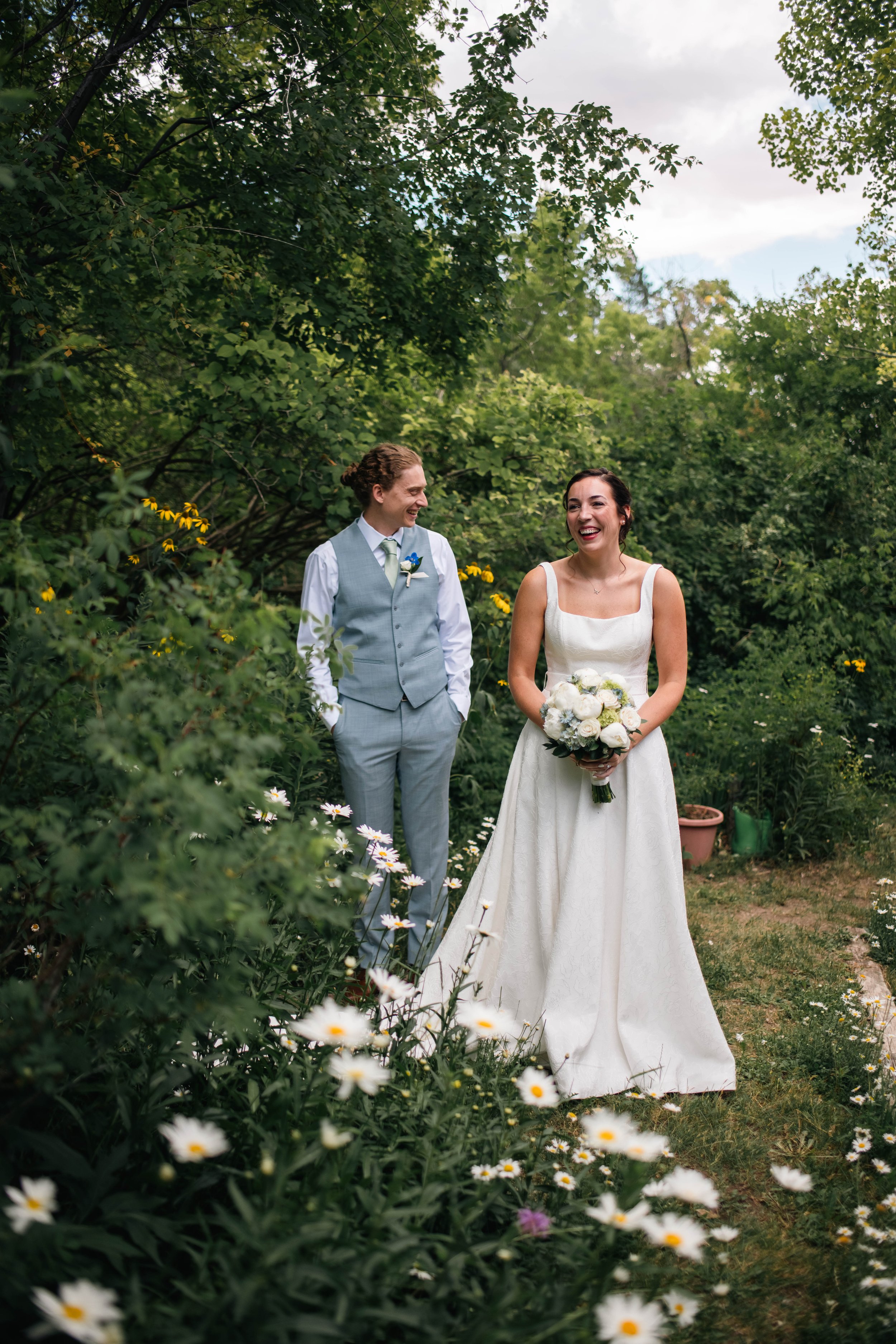 Documentary style photo of a couple smiling together after their wedding ceremony in Albuquerque New Mexico