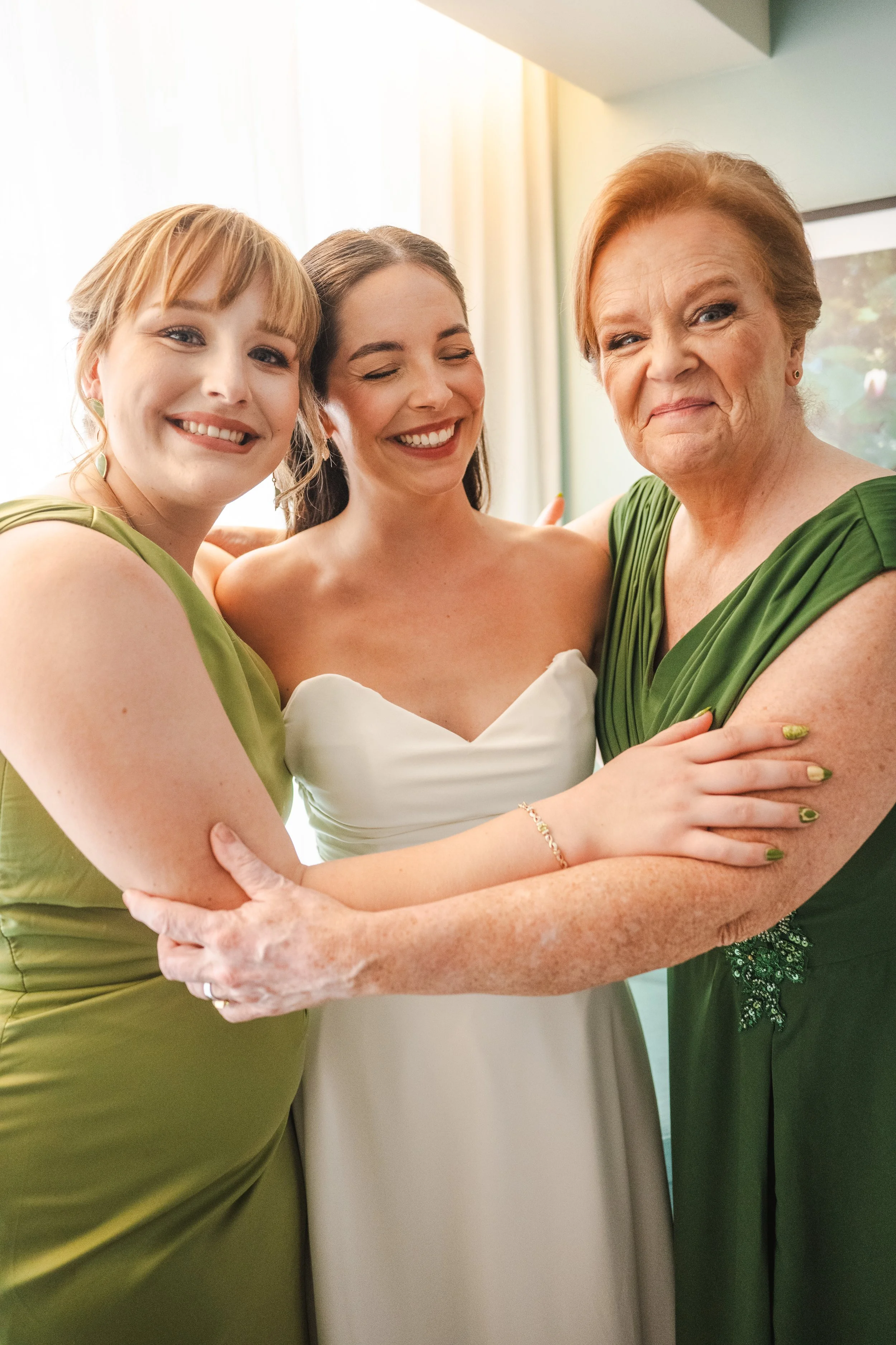 bride-embracing-family-getting-ready-mapr-san-juan-puerto-rico-wedding.jpg