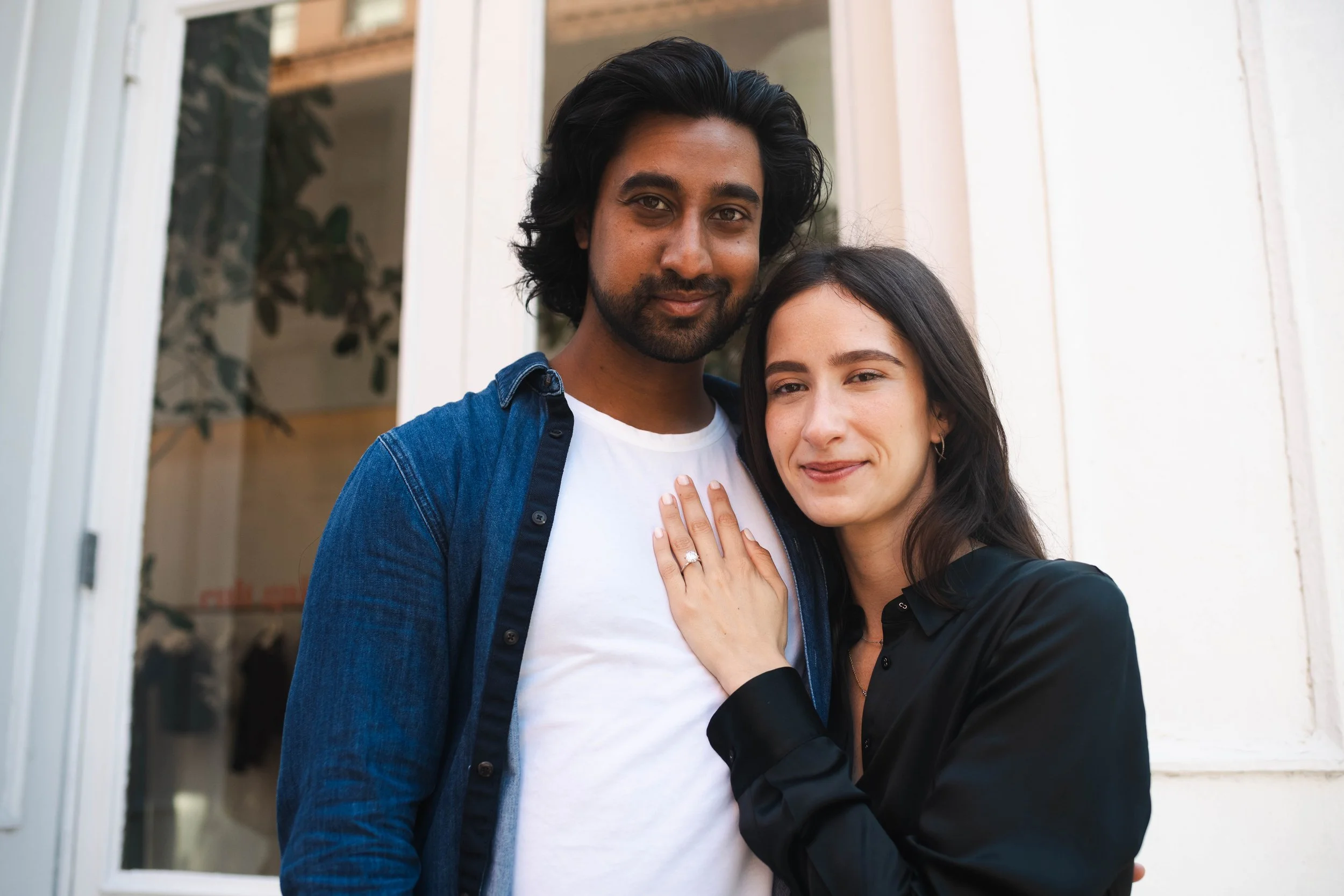 Couple smiling together during an engagement photo session in SoHo New York City
