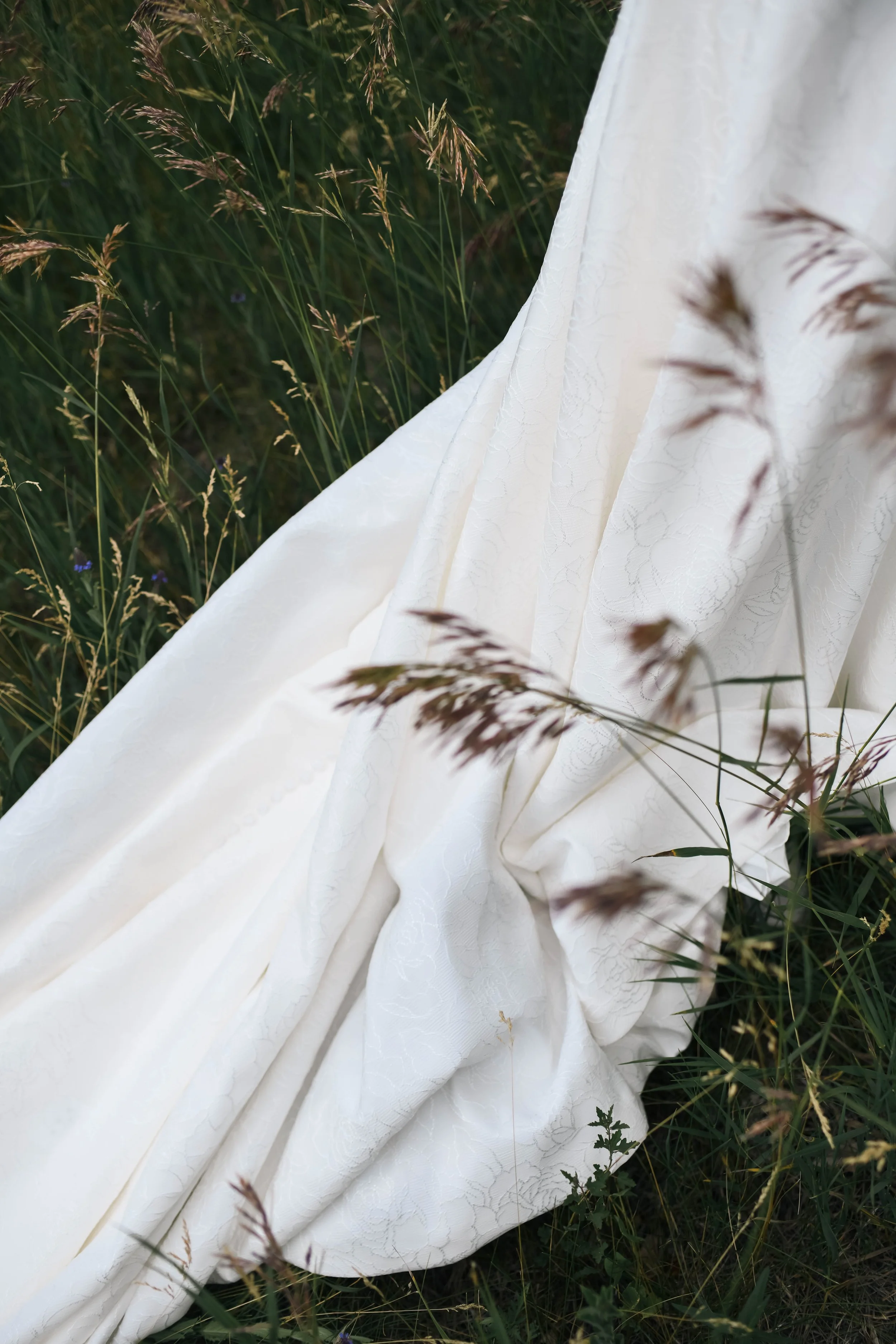 Detail shot of a bride's dress train at an outdoor wedding in Albuquerque New Mexico
