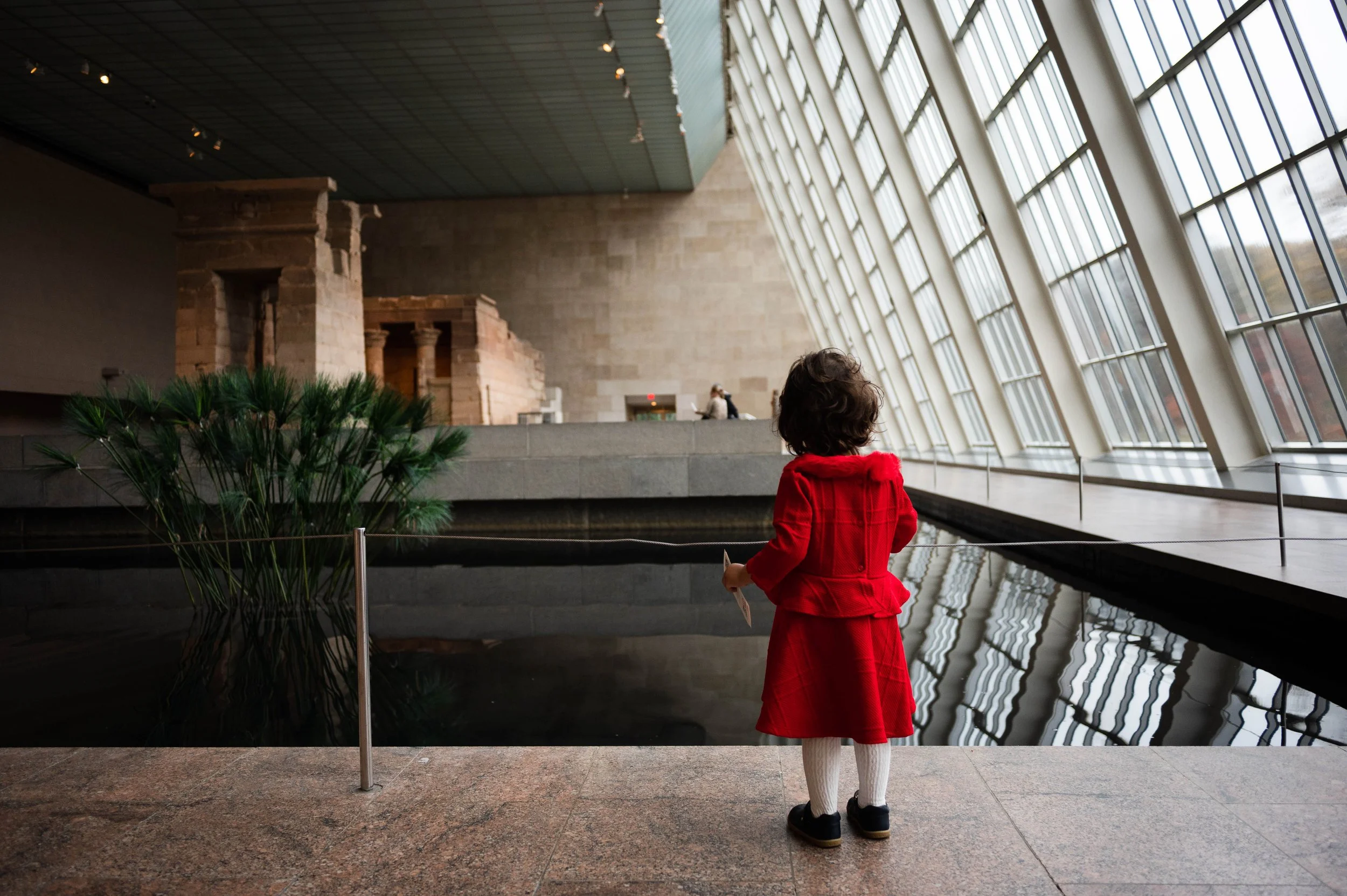 Child looking at artwork during a visit to the Metropolitan Museum of Art in New York City