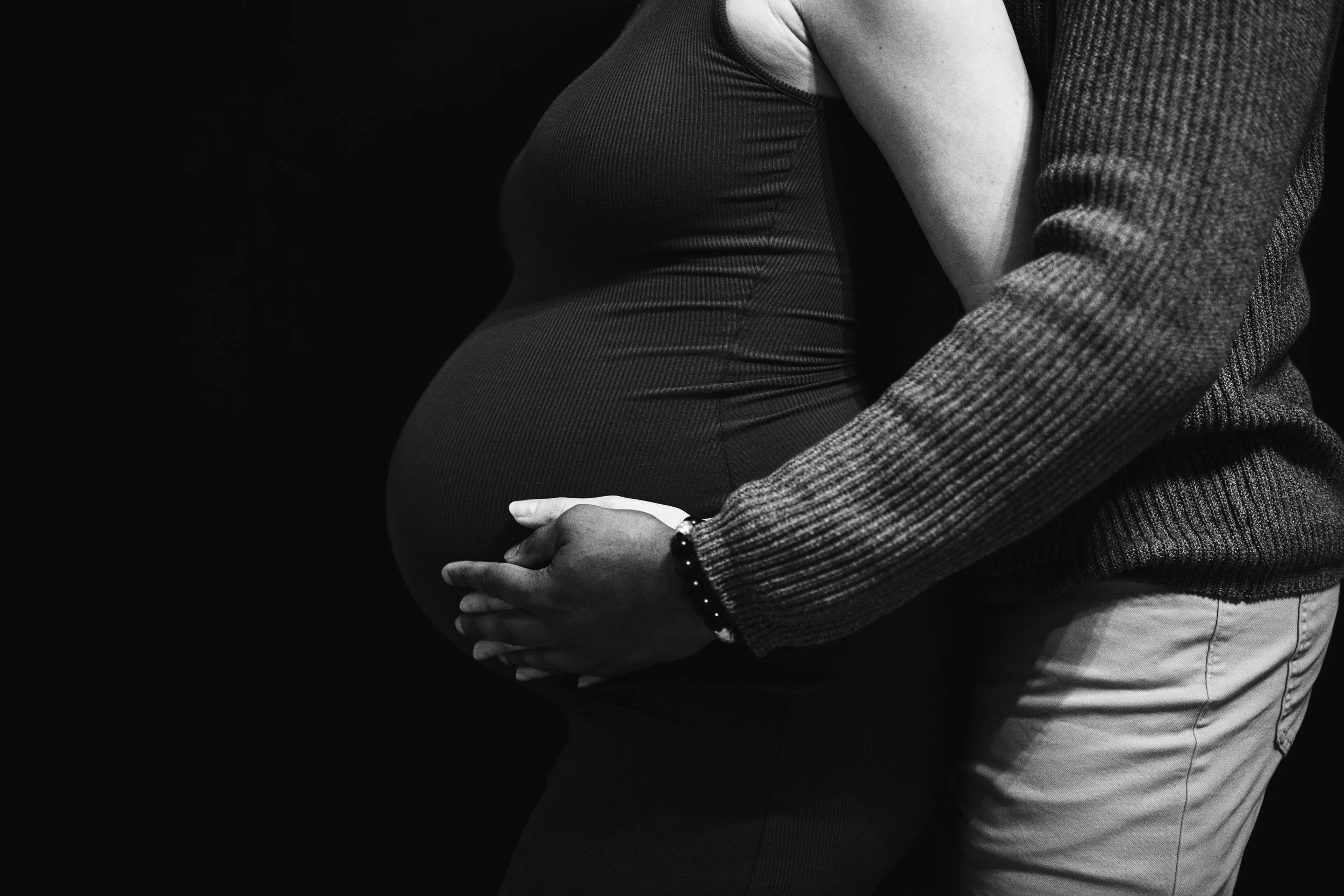  Editorial style maternity photo showcasing a baby bump