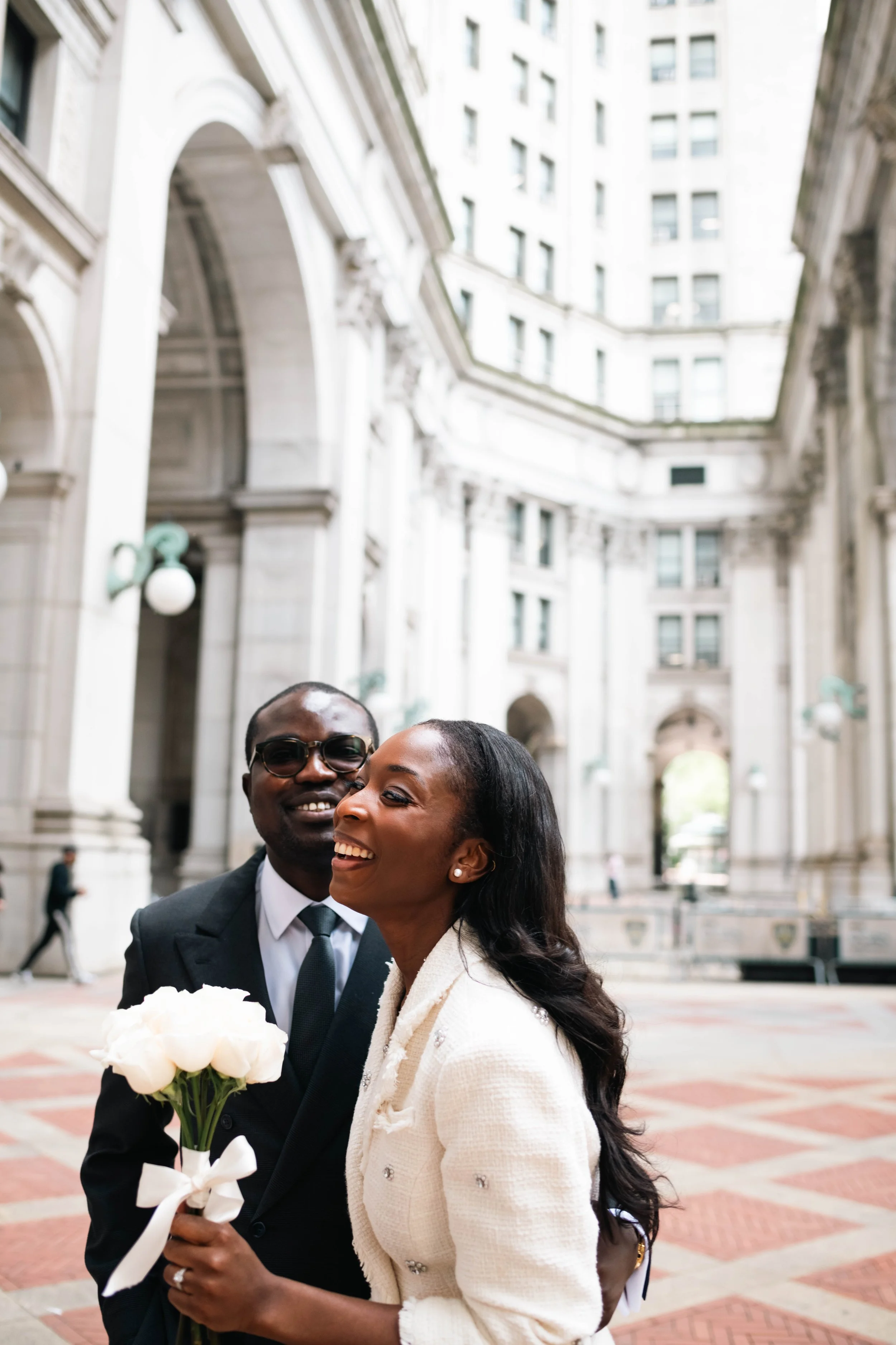 Couple laughing together outside after their Manhattan courthouse wedding ceremony