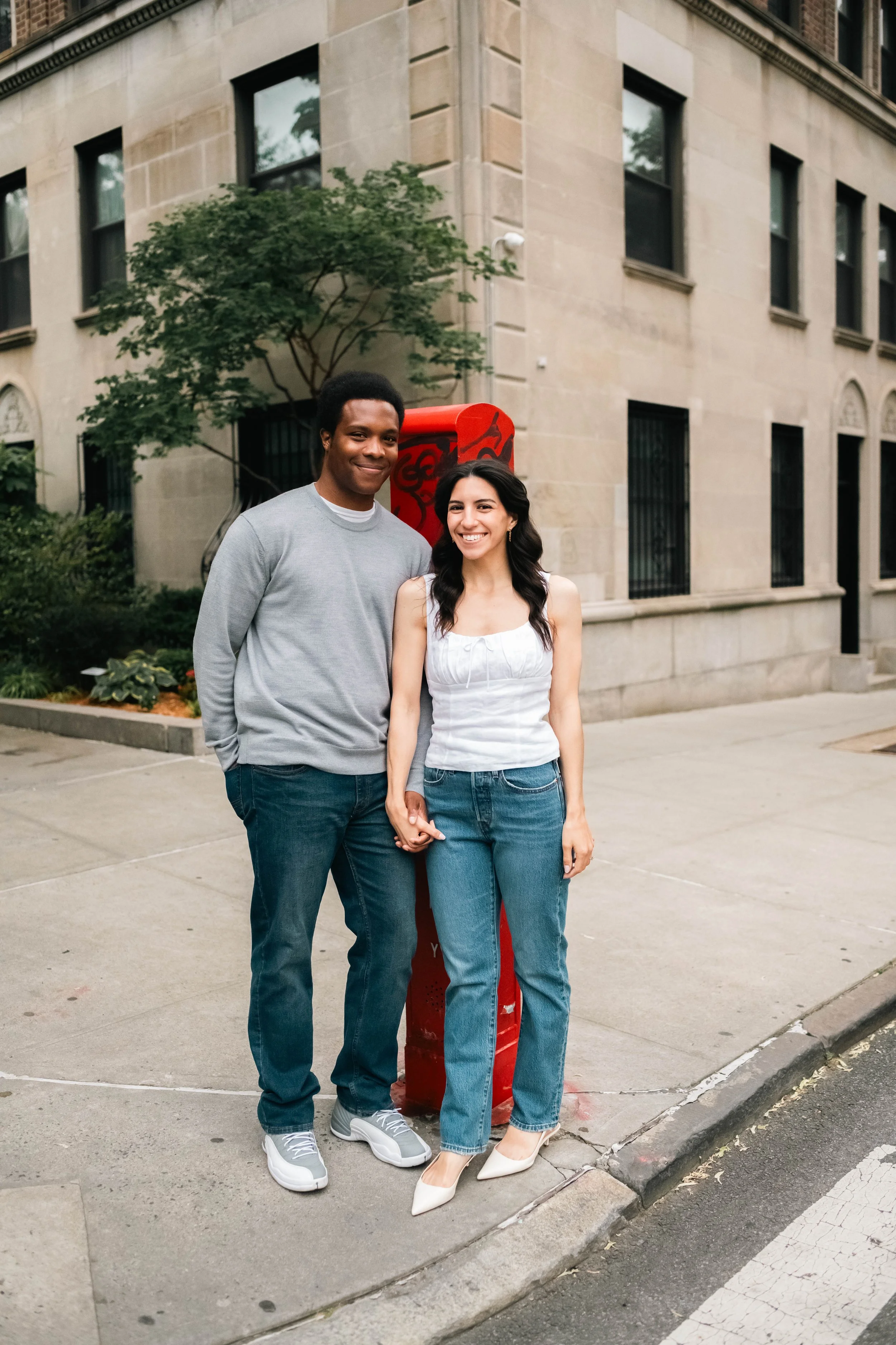 Couple posing near Prospect Park during an engagement session
