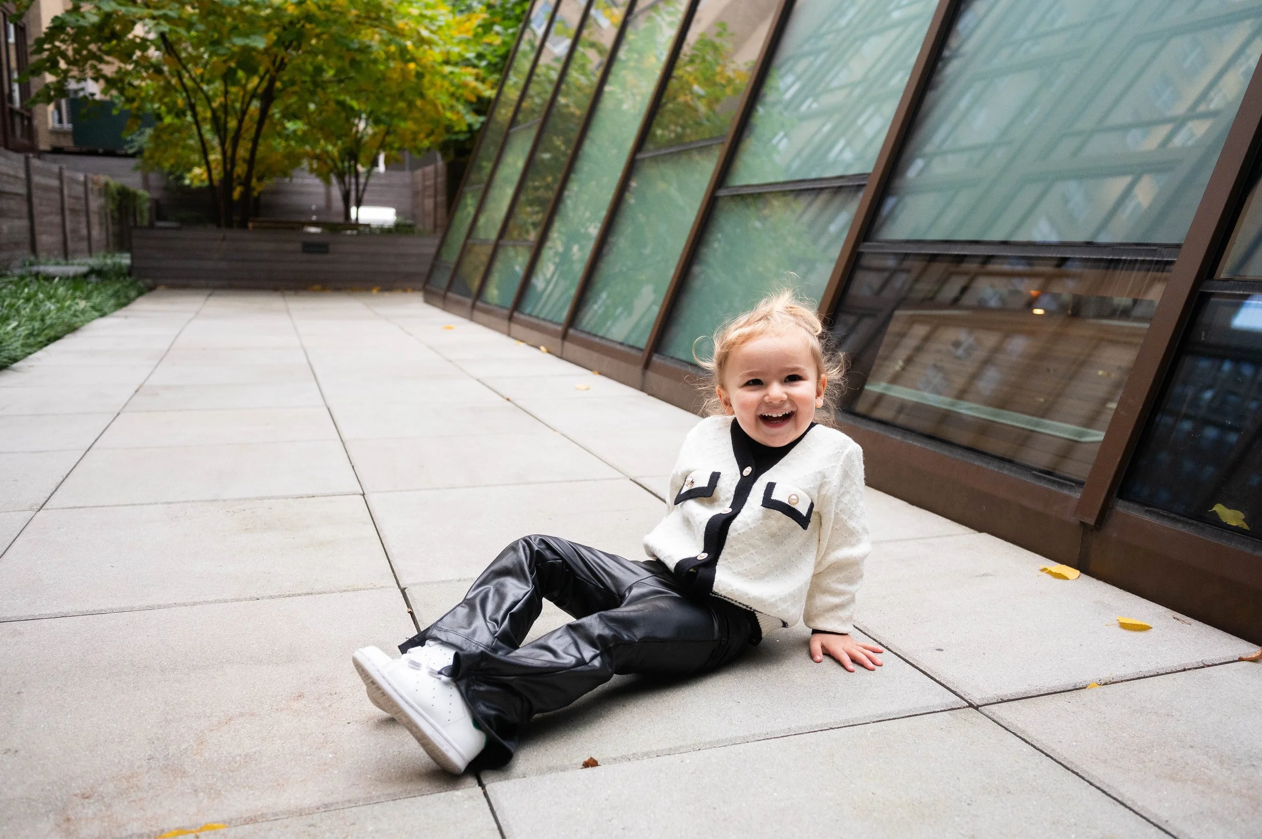 Child posing on the patio of a Manhattan apartment complex