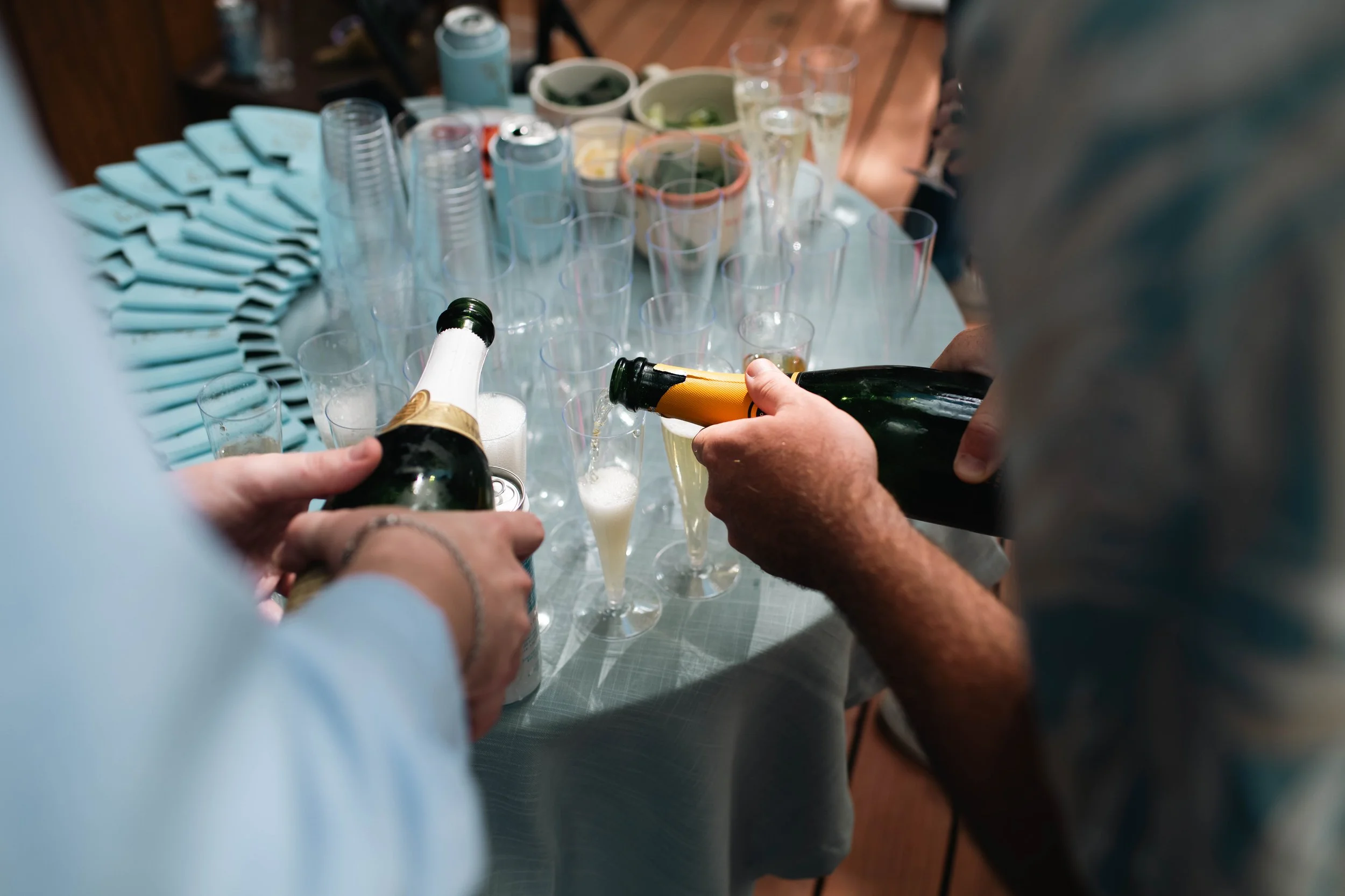 Wedding guests pouring champagne during the celebration at an Albuquerque New Mexico wedding
