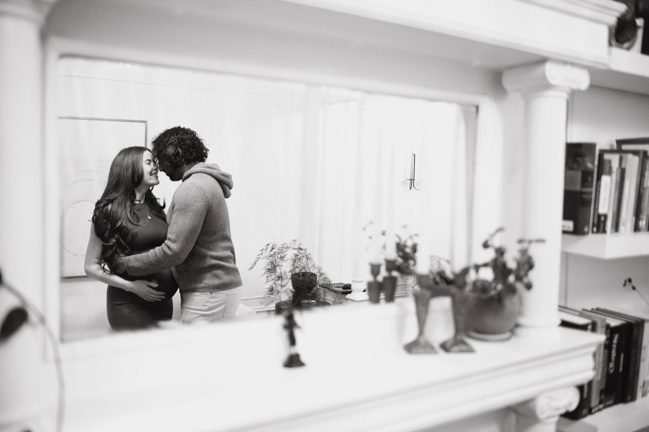 Artistic portrait of a couple embracing inside their Brooklyn apartment