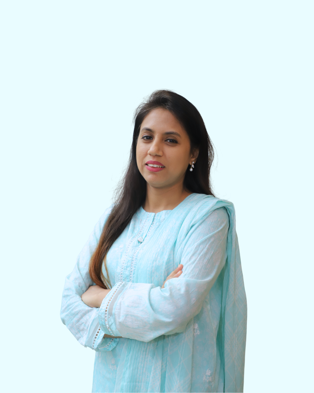 A woman with long dark hair, wearing a light blue traditional dress, standing with arms crossed against a light blue background.