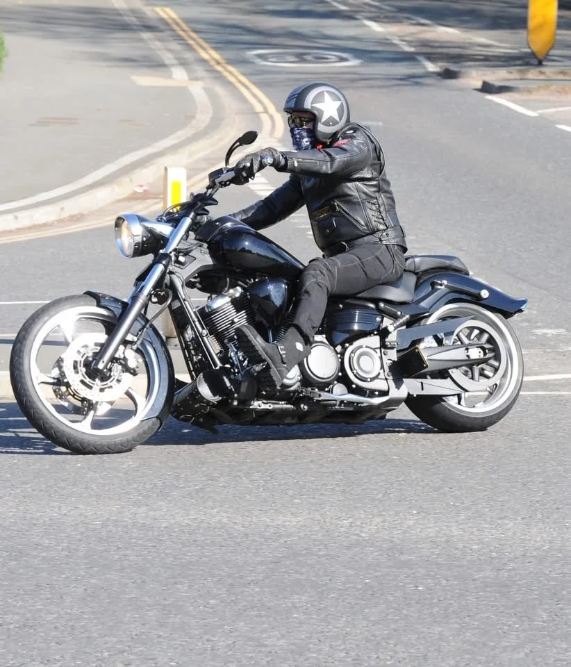 Jason Barnes Founder of Dragon Forge Advisory, Riding a mortorcylle.
