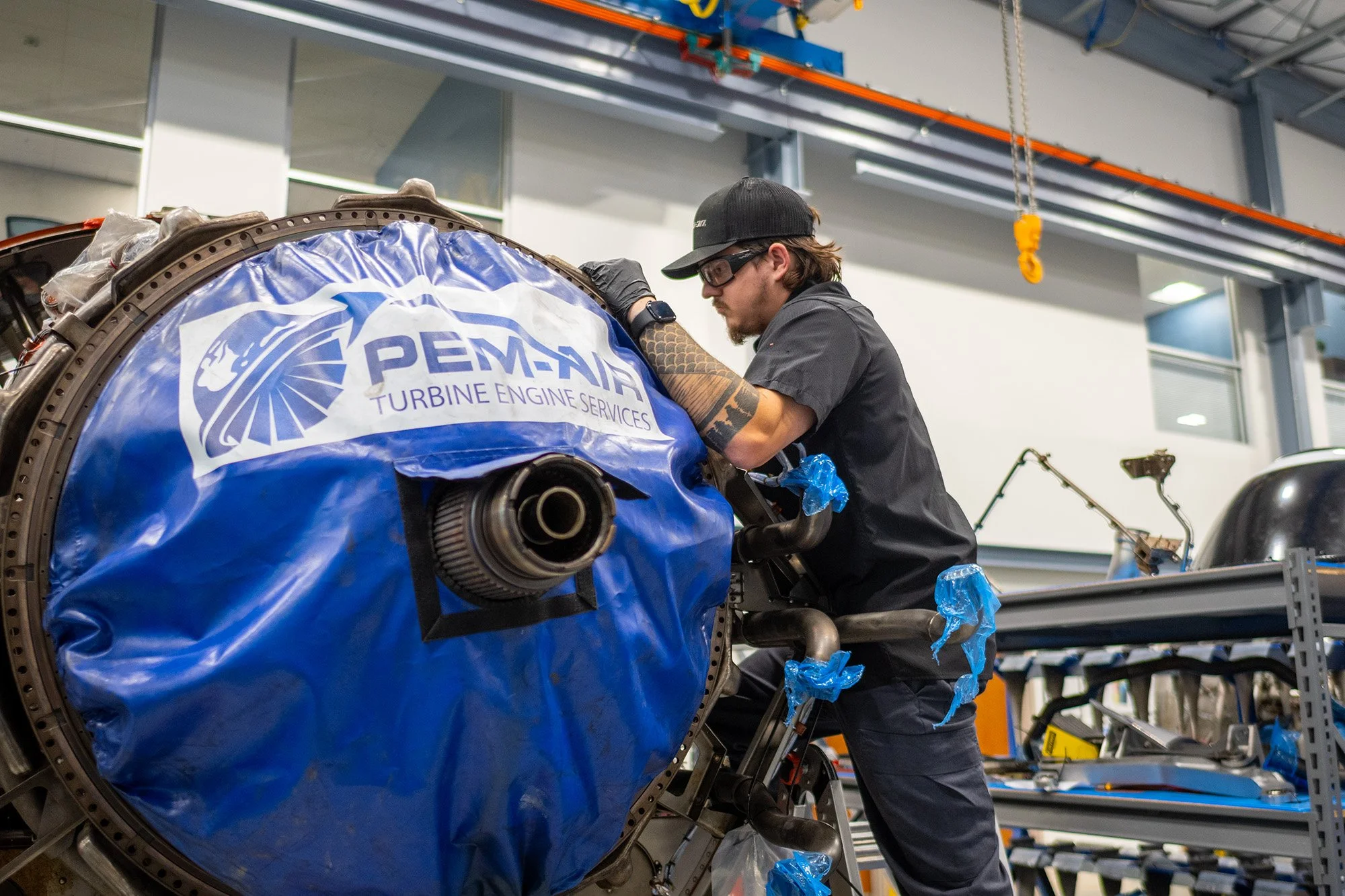 mechanic working on jet engine