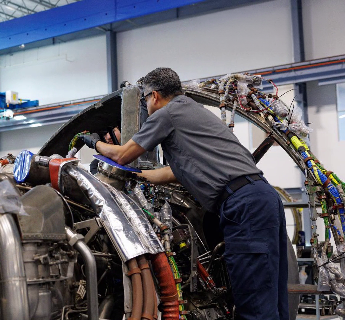 mechanic working on engine