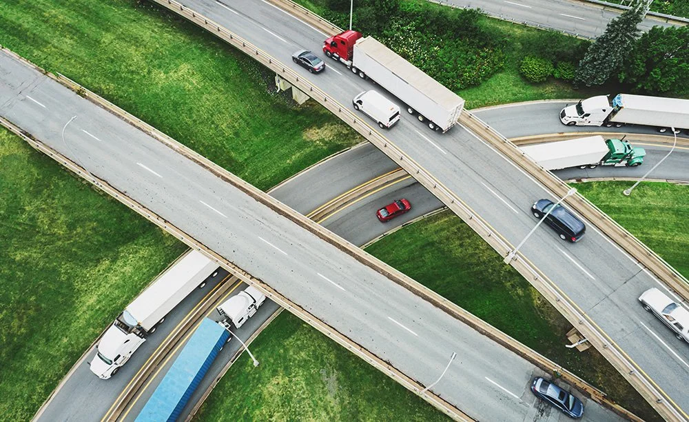 Trucks on a highway overpass