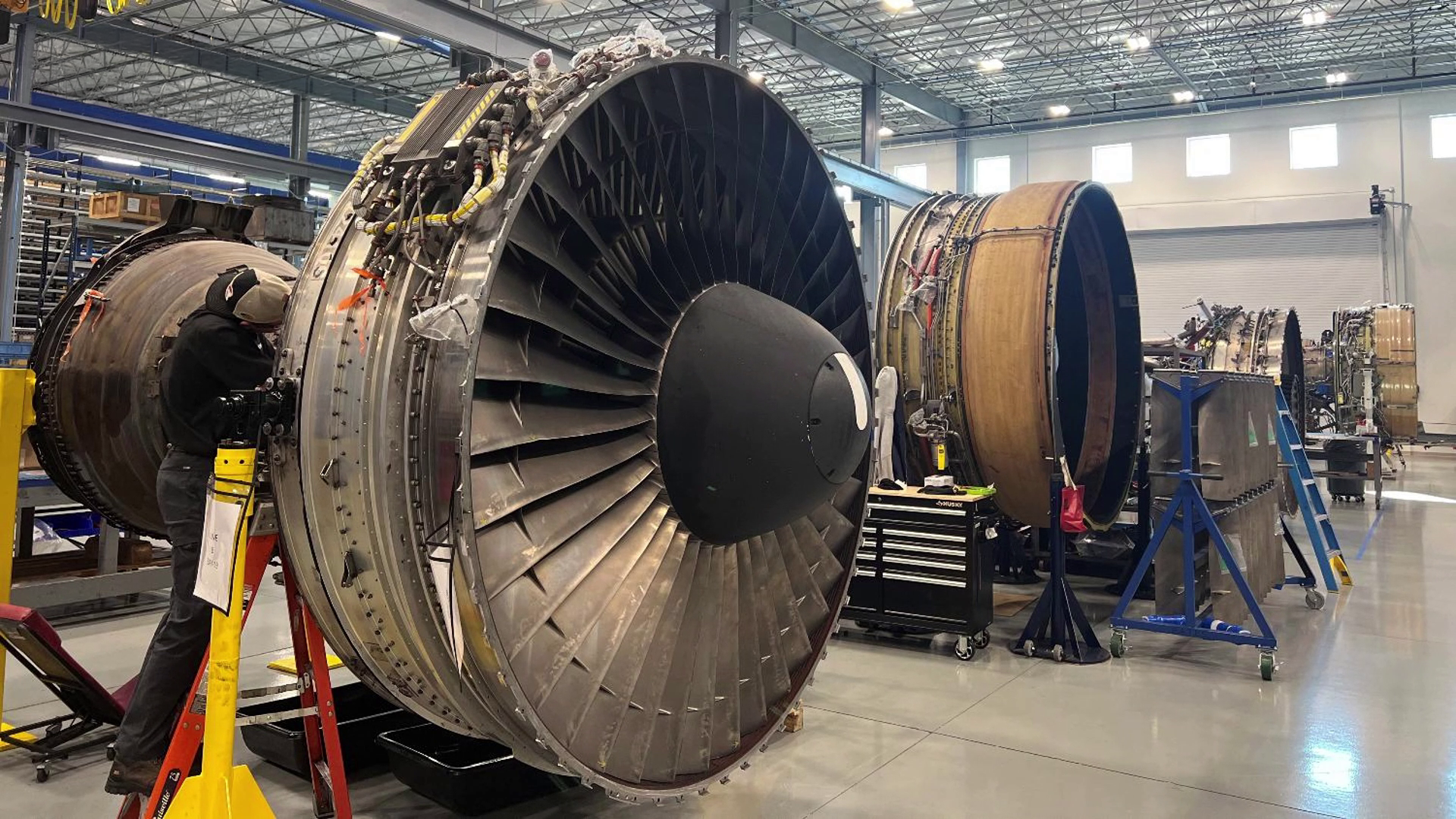 engines being worked on inside warehouse