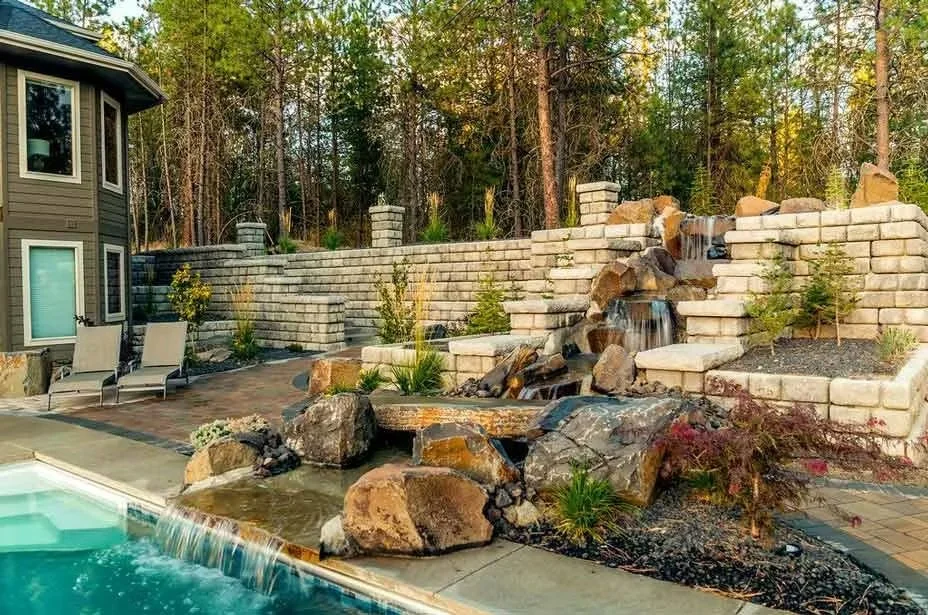 Residential Redi-Rock retaining wall creating a durable and attractive outdoor space.