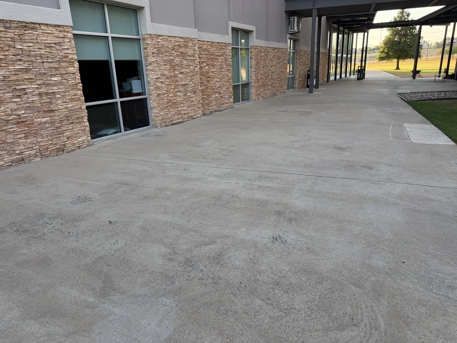 Before: concrete courtyard at a Mansfield church campus before cleaning.