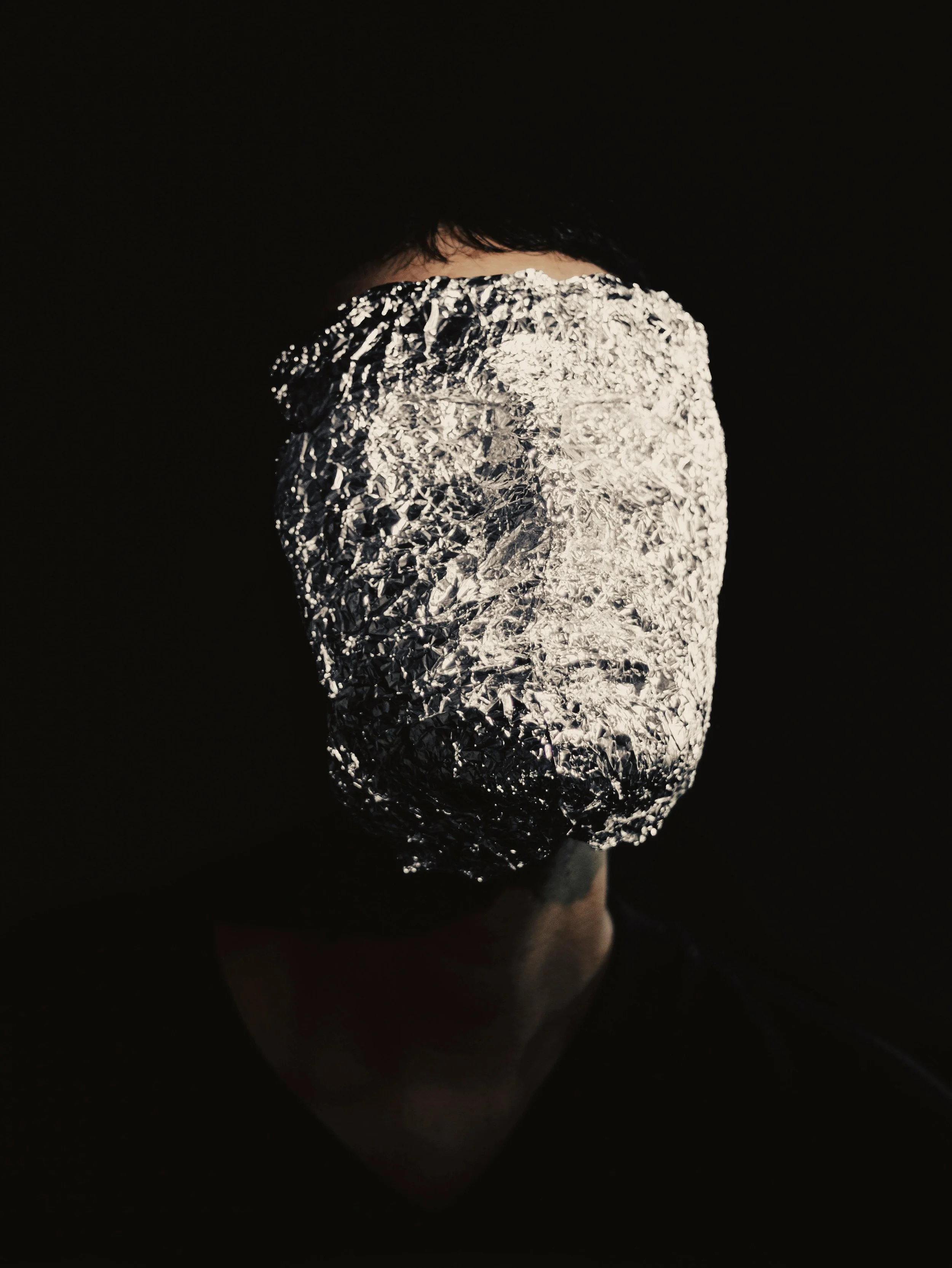 Photo by Vitor Diniz: https://www.pexels.com/photo/person-with-face-wrapped-in-tin-foil-31227671/