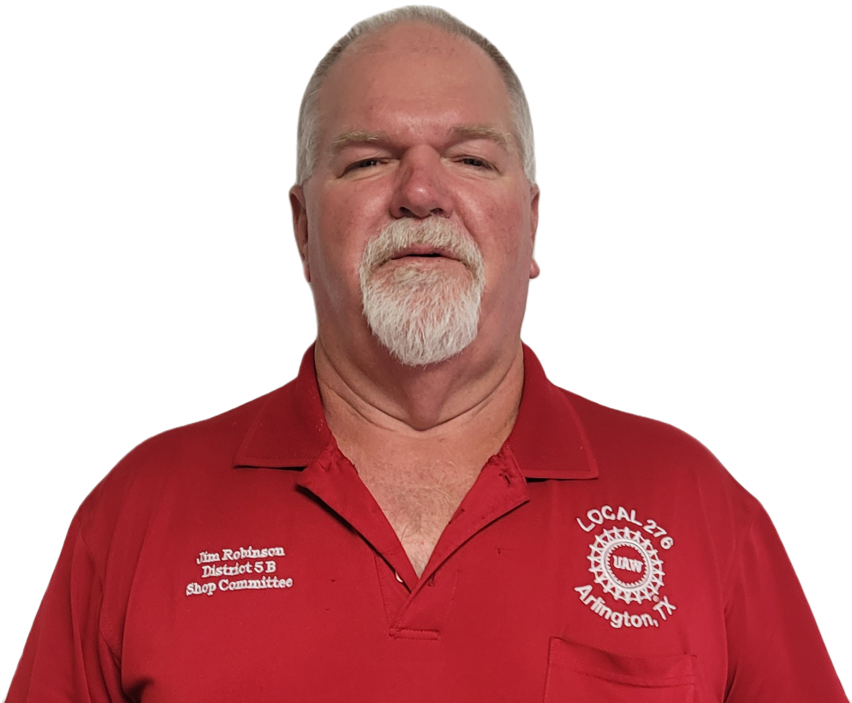 A middle-aged man with a white beard and mustache, wearing a red polo shirt with patches and embroidery, standing against a black background.