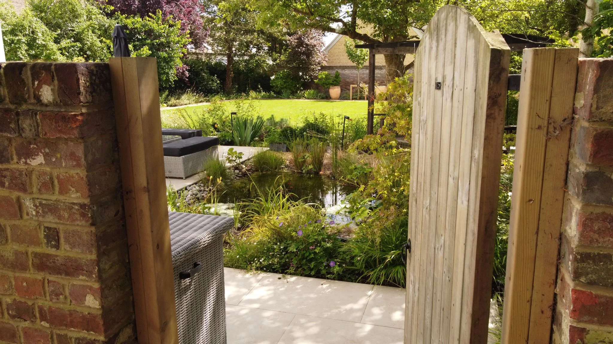 View through an entrance into a planted courtyard garden.