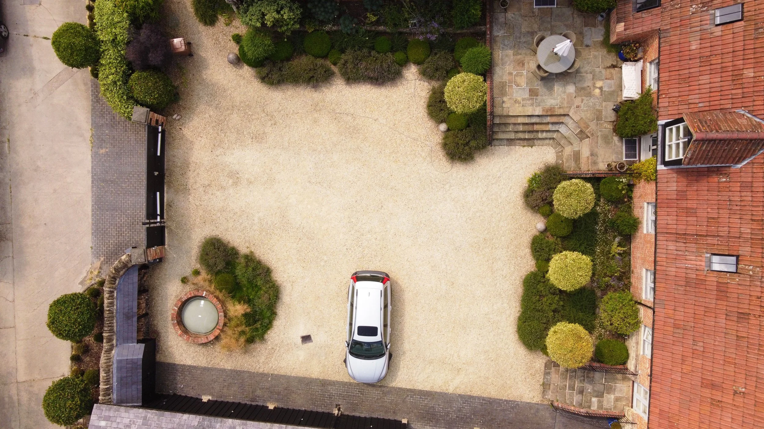 Courtyard garden design in Oxfordshire with structured layout and planting