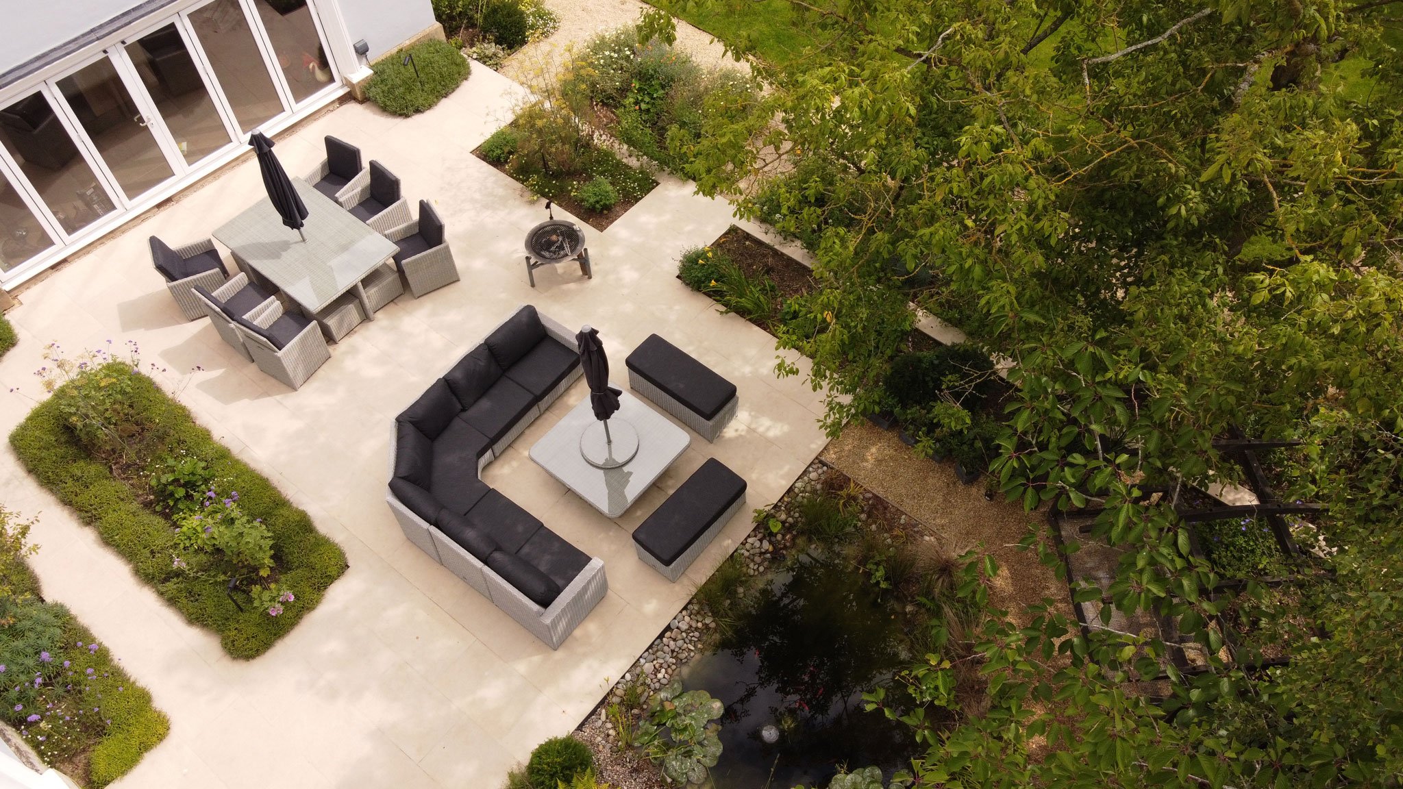 2 seating area on porcelain paving, planting integrated, lavender hedges and perrenials inside