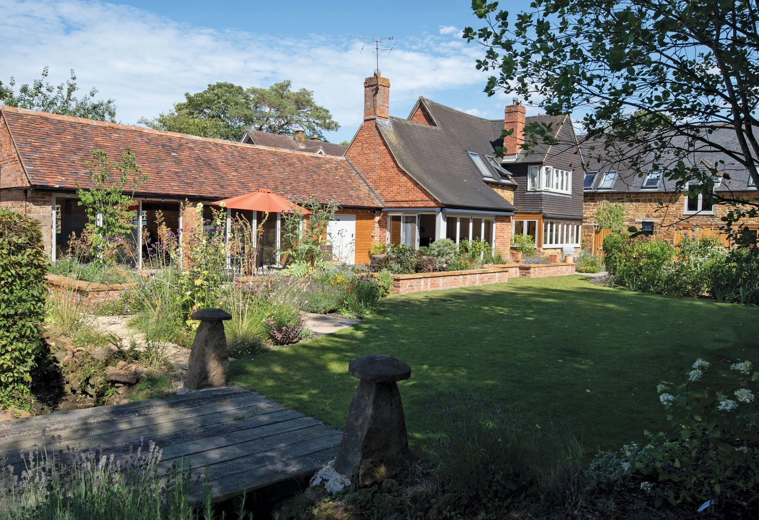 Completed courtyard garden around the Grade II listed house and converted barns in Fenny Compton.