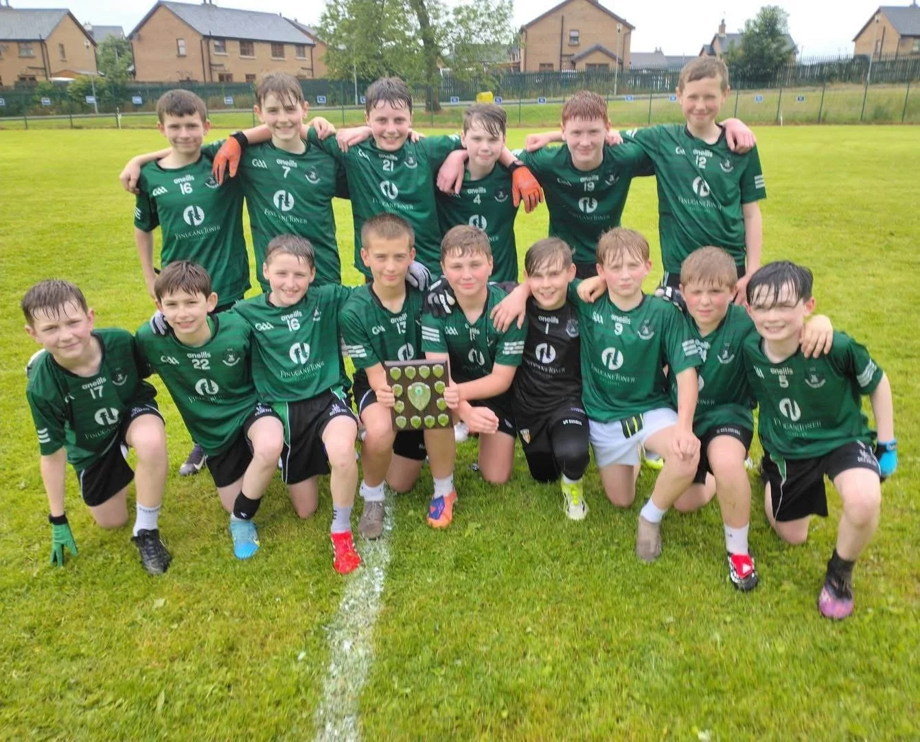 Gaelic Footballers from St. Malachy's College with their shield
