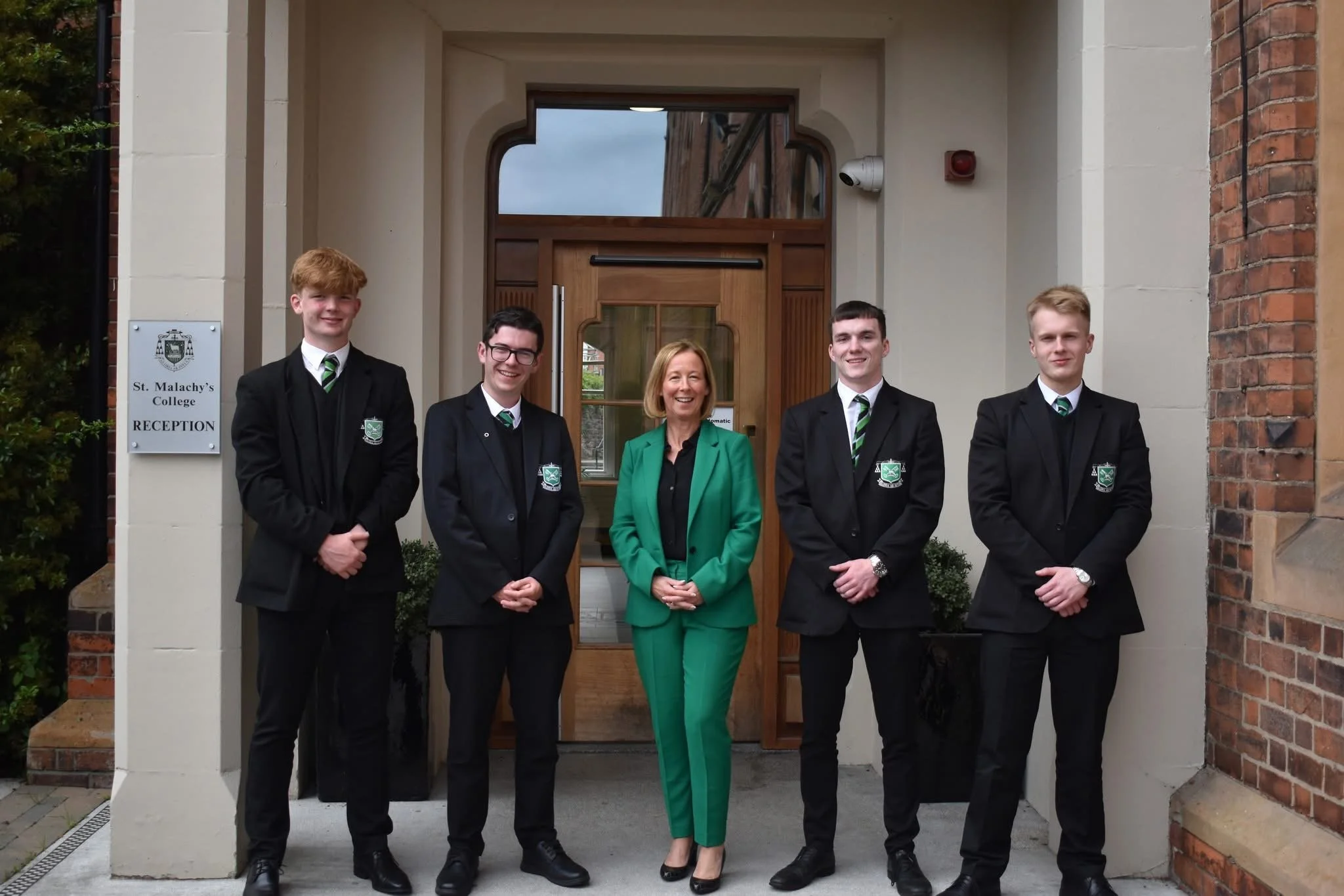 Year 13 Students from St Malachy's College with Principal Deirdre McCusker