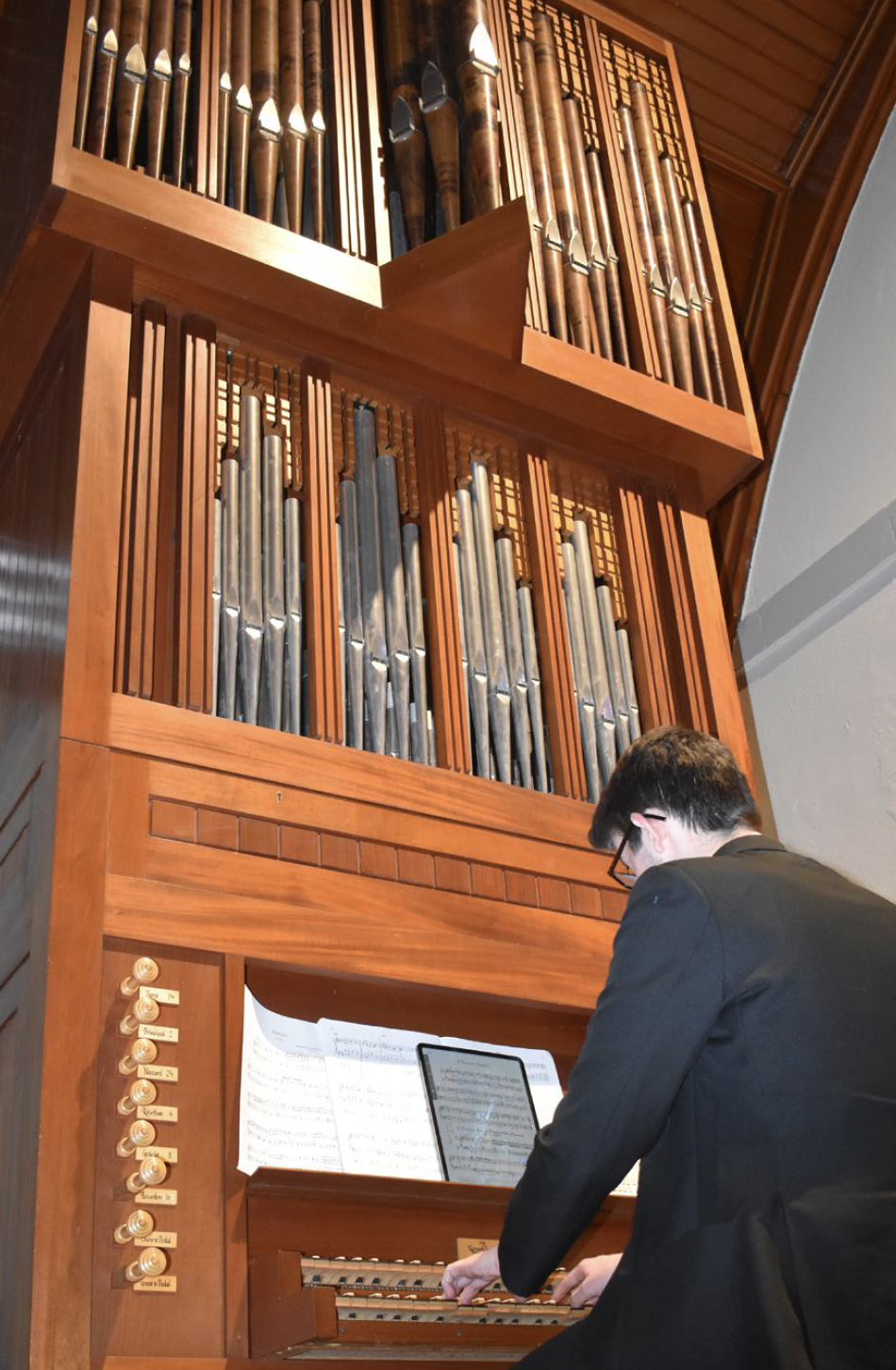 St Malachy's College student playing the organ