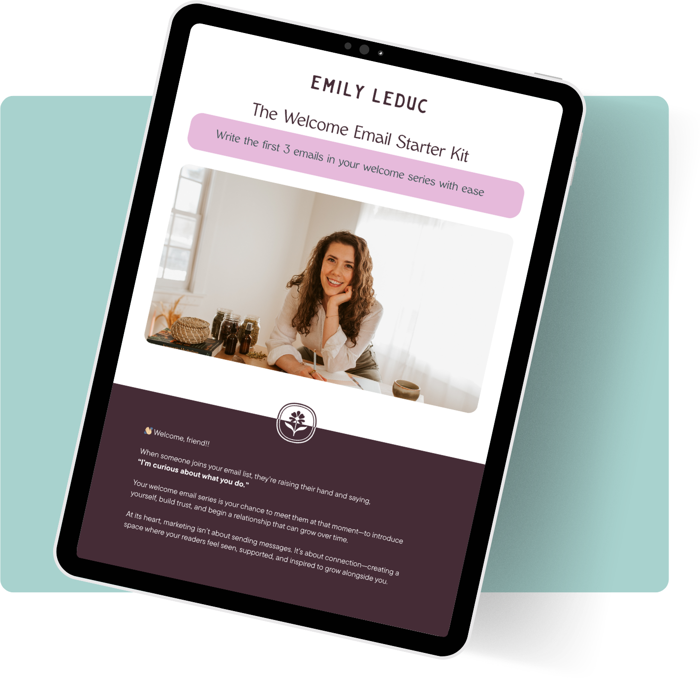 Digital tablet displaying a webpage titled "Emily Leduc The Welcome Email Starter Kit" featuring a smiling woman sitting at a desk with jars and a hat behind her, and a section with a welcome message and information about building relationships through email marketing.