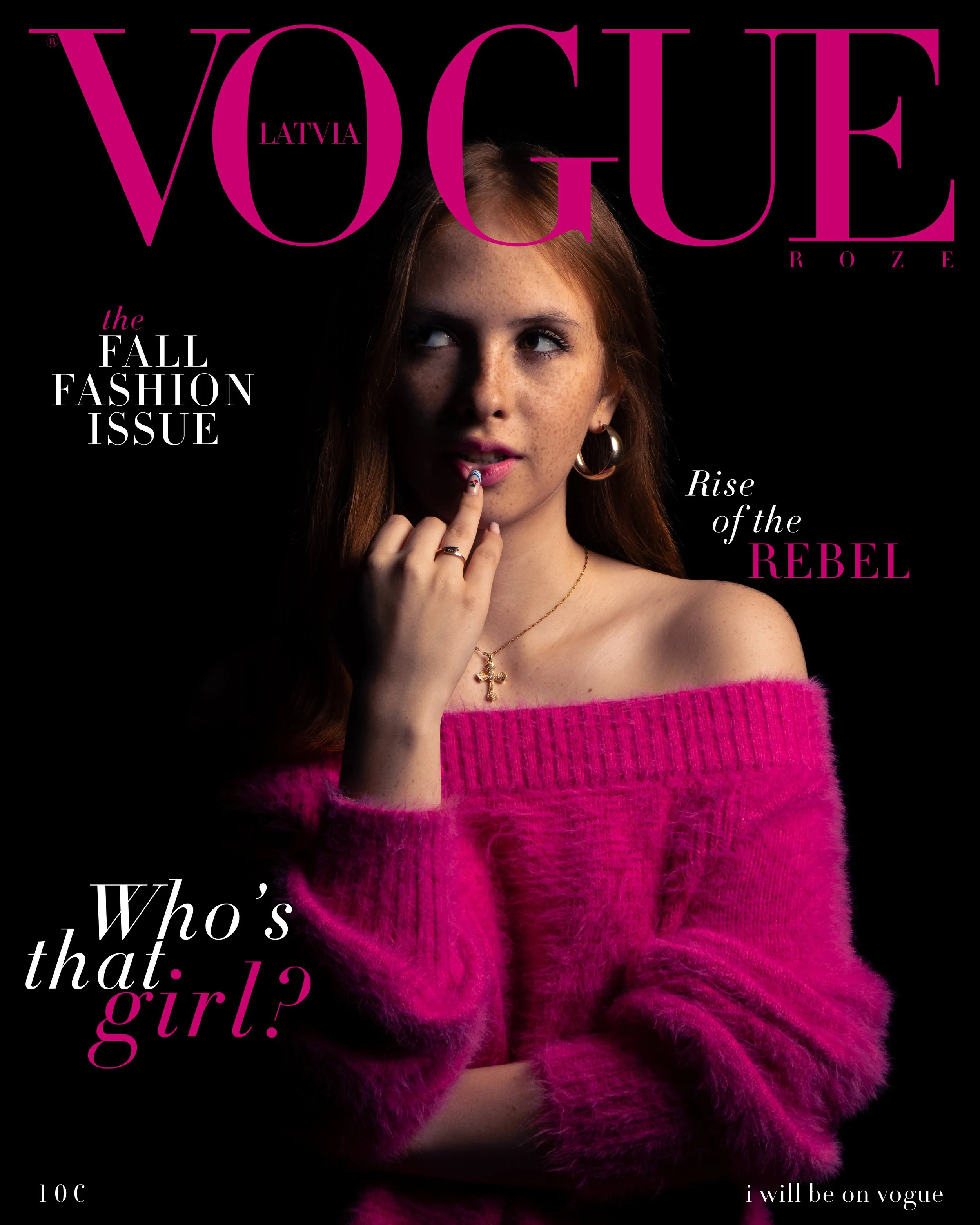 Vogue Latvia magazine cover featuring a red-haired woman with freckles wearing a pink fuzzy sweater, gold hoop earrings, and a cross necklace, with pink and black text