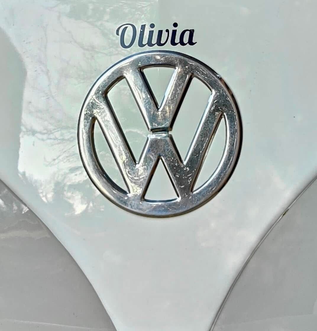 VW badge with the name Olivia on our split-screen campervan