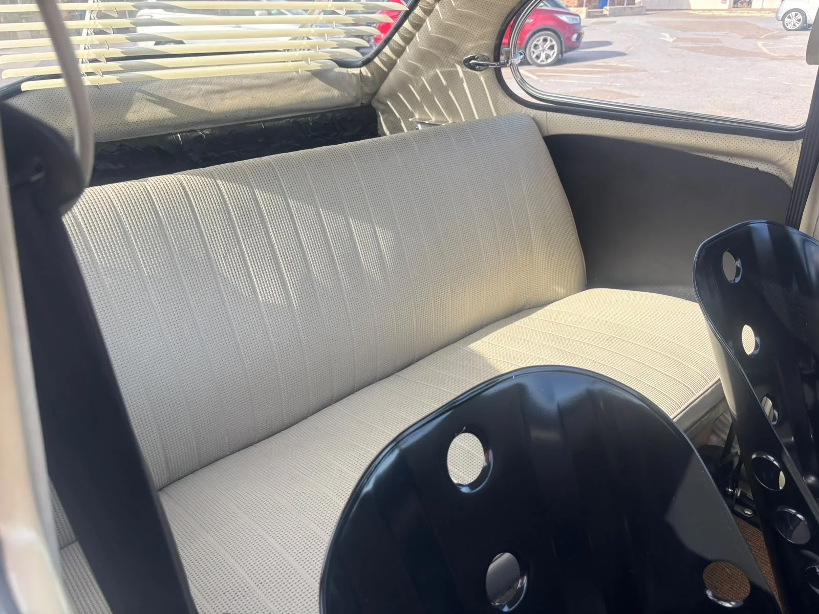 Cream rear bench seat inside Elvis, our vintage VW Beetle wedding car