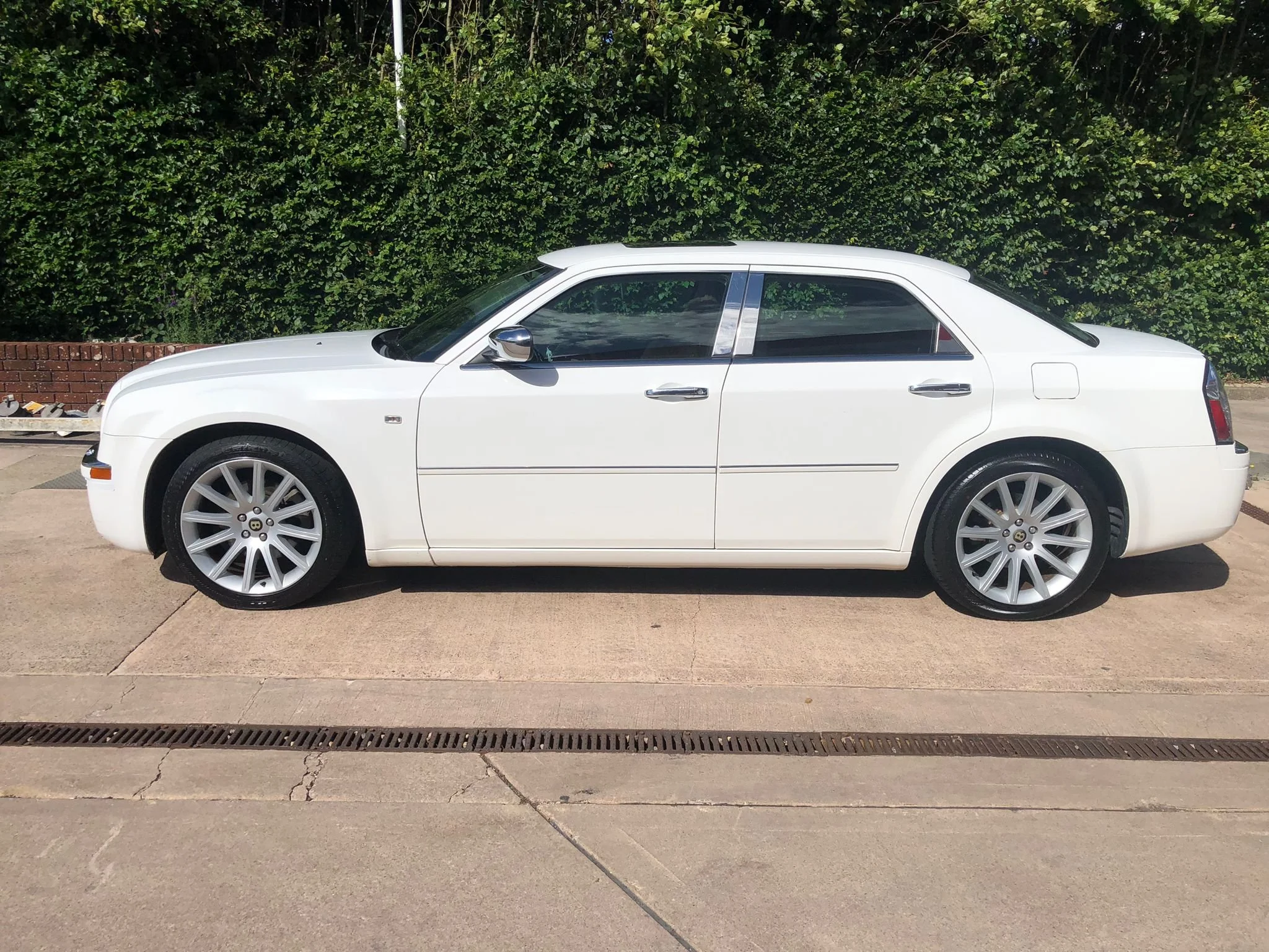 Side profile of the white Chrysler 300 Baby Bentley