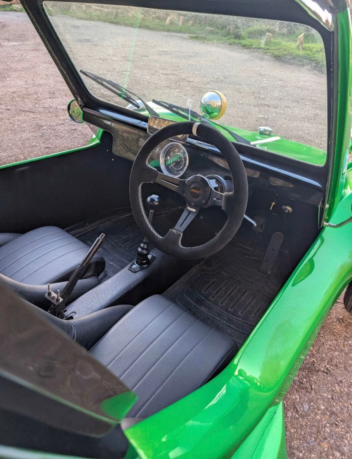 Steering wheel and dials inside The Hulk green VW beach buggy