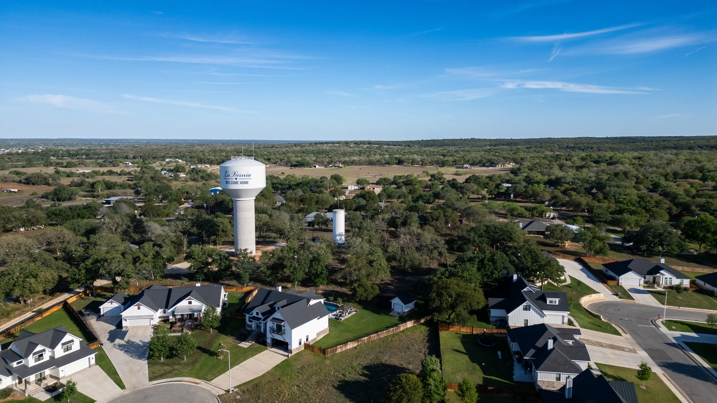 Aerial view of homes and the La Vernia water tower in La Vernia, Texas.