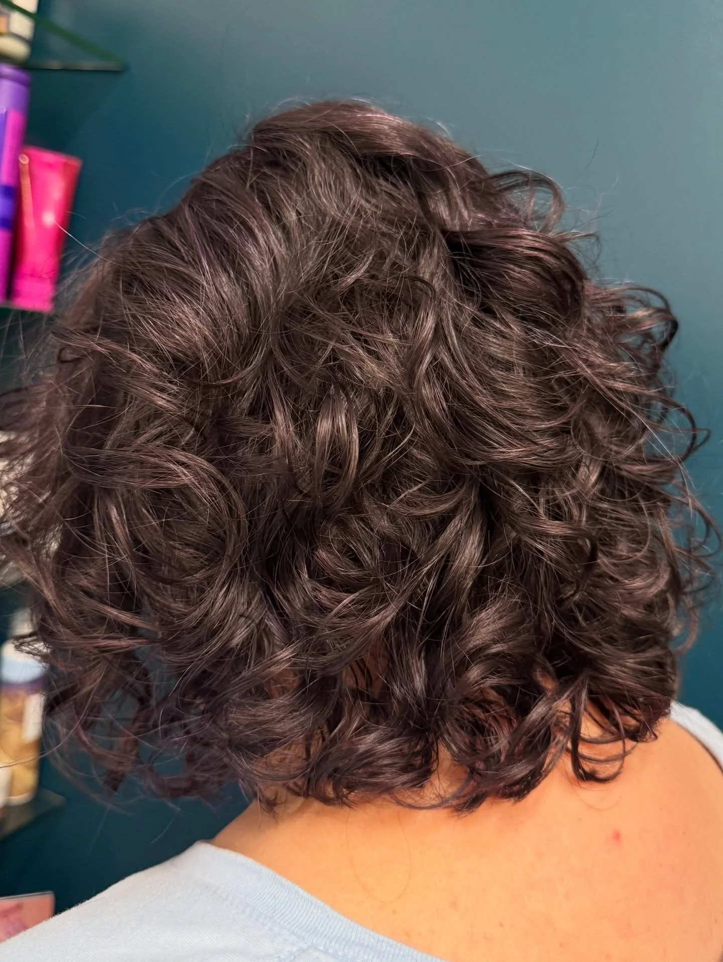A true curl transformation with a rich plum haze. I'm obsessed with how this subtle fantasy shade complements her natural silver tones and creates an optical illusion in the light.