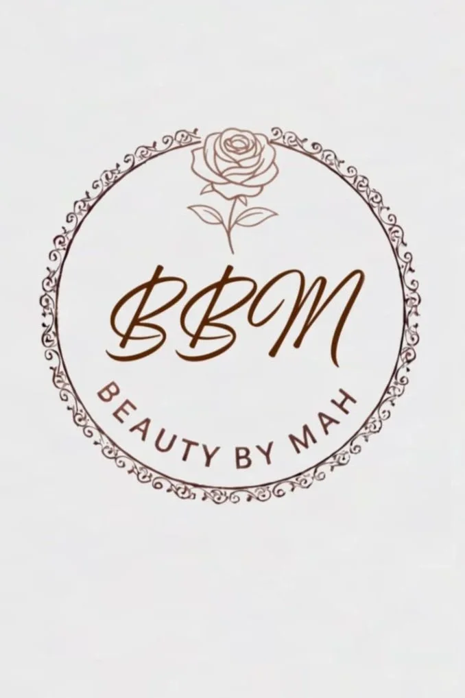 Logo for Beauty by Mah, featuring a rose and decorative circle.