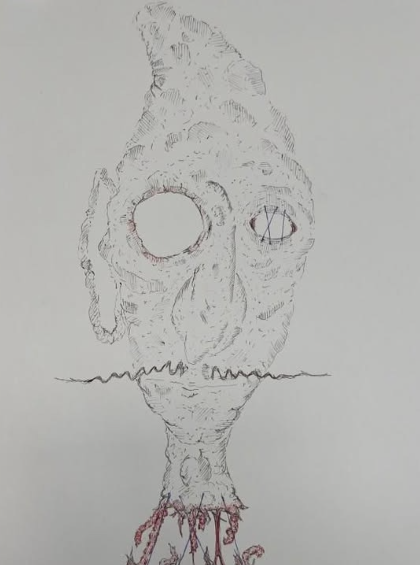 Line drawing of a fish with a skull-like face, one large eye socket and a nose cavity, with the mouth at the bottom. The fish appears to be rotting or decomposing, with visible ribs and a tail with some frayed fins. Red lines highlight the bottom and parts of the tail, giving an ominous appearance.
