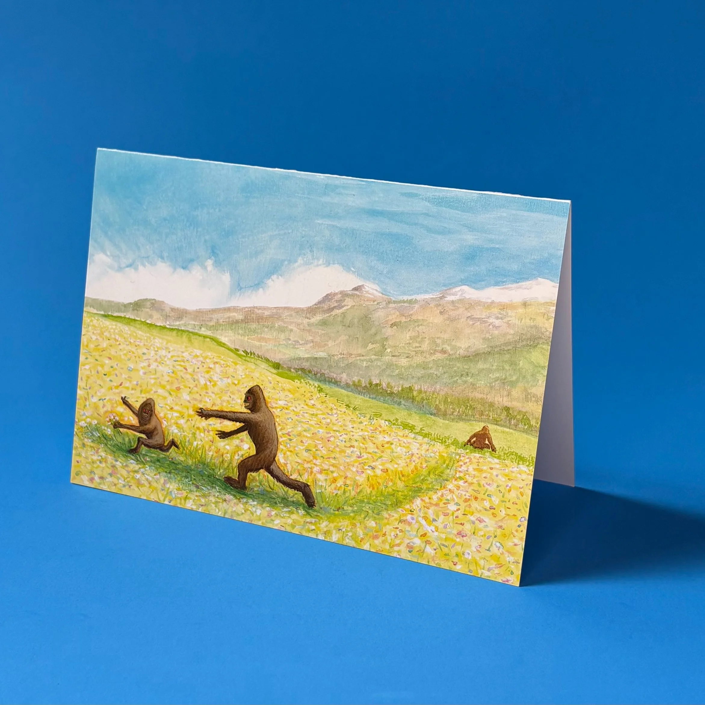 Greeting Card - "Sasquatch siblings in a meadow"