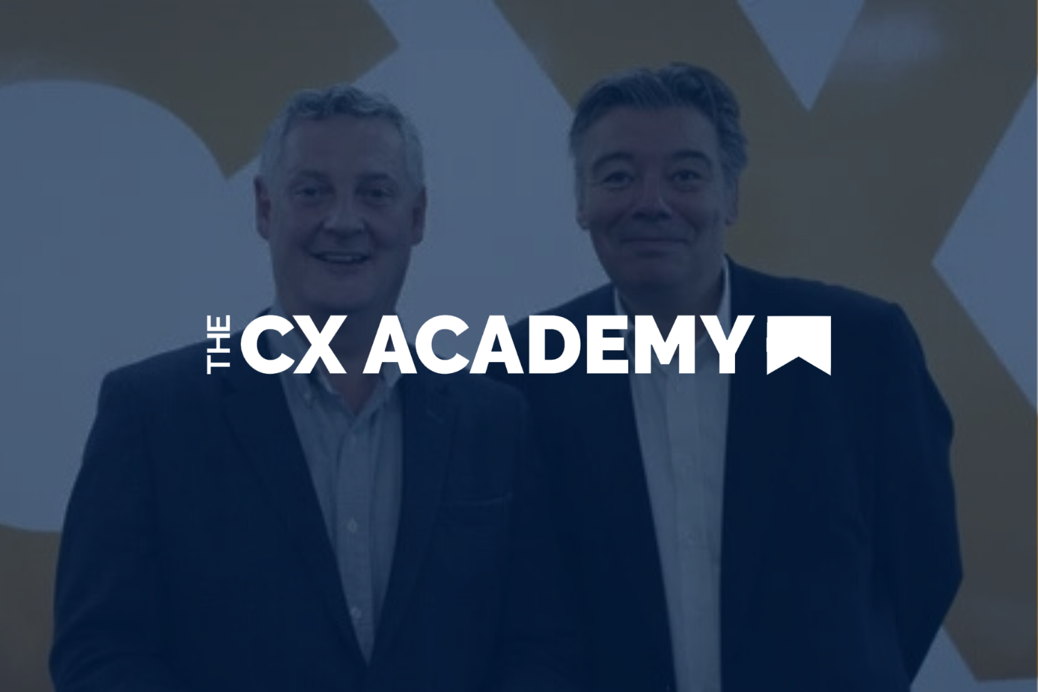 Two men in suits standing in front of a yellow and white background with the text 'The CX Academy' in front of them.