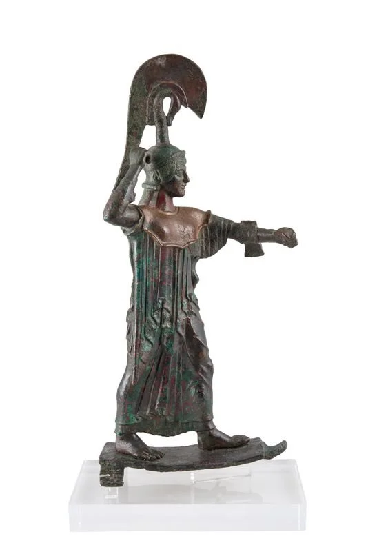 Name: Statuette of Athena Promachos.
Creator: N/A.
Dating Back Bo: 475-470 BC.
Material: Copper.
Found In: 1887 to the east of the Erechtheion.