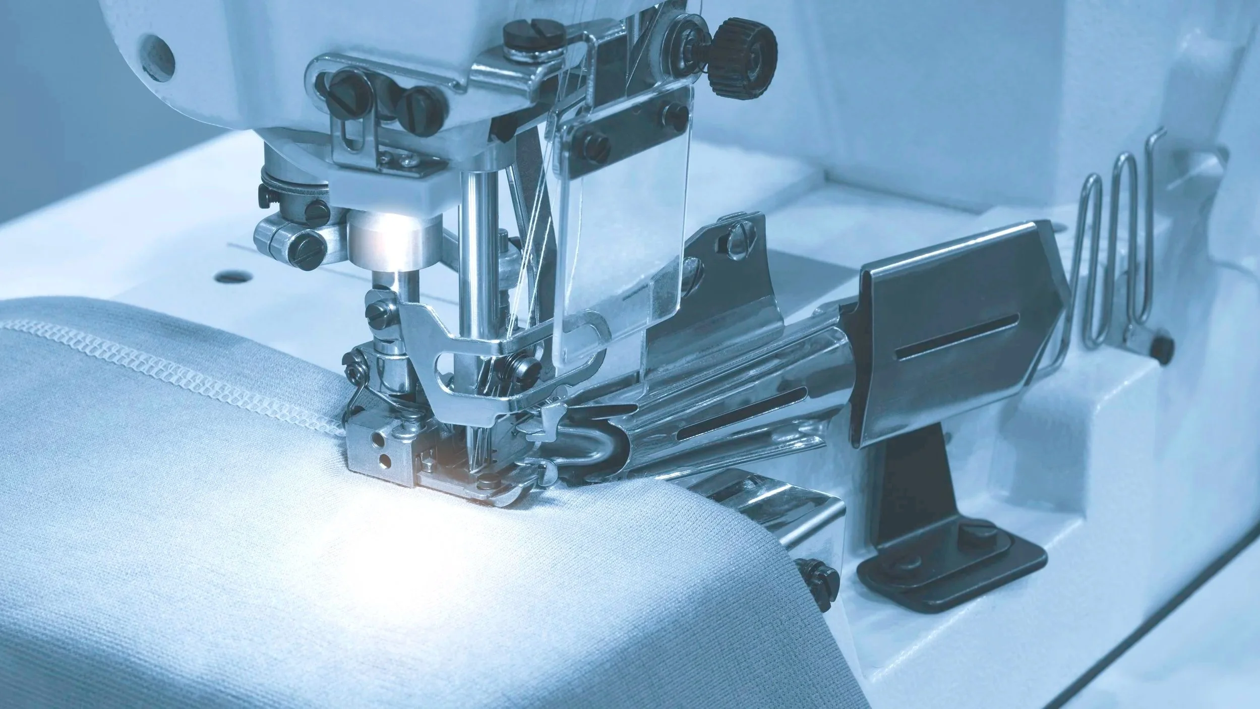 Industrial sewing equipment used for textile manufacturing and quality-controlled production processes.