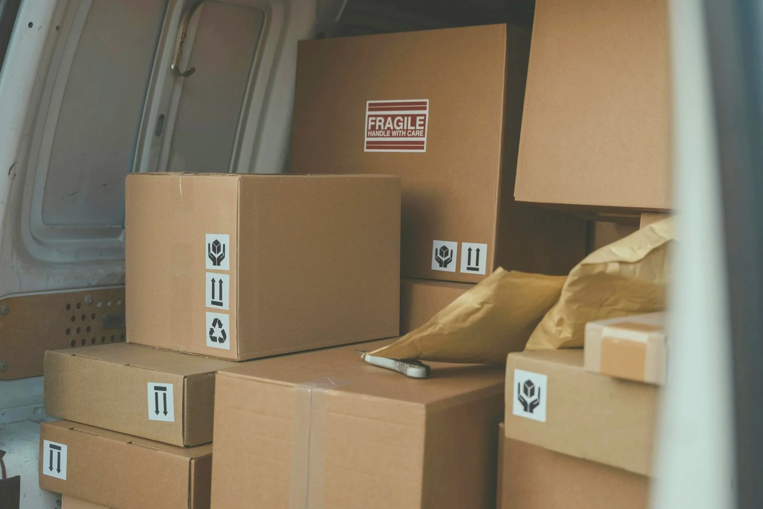 Packaging and fulfillment materials prepared for organized shipping, labeling, and distribution processes.
