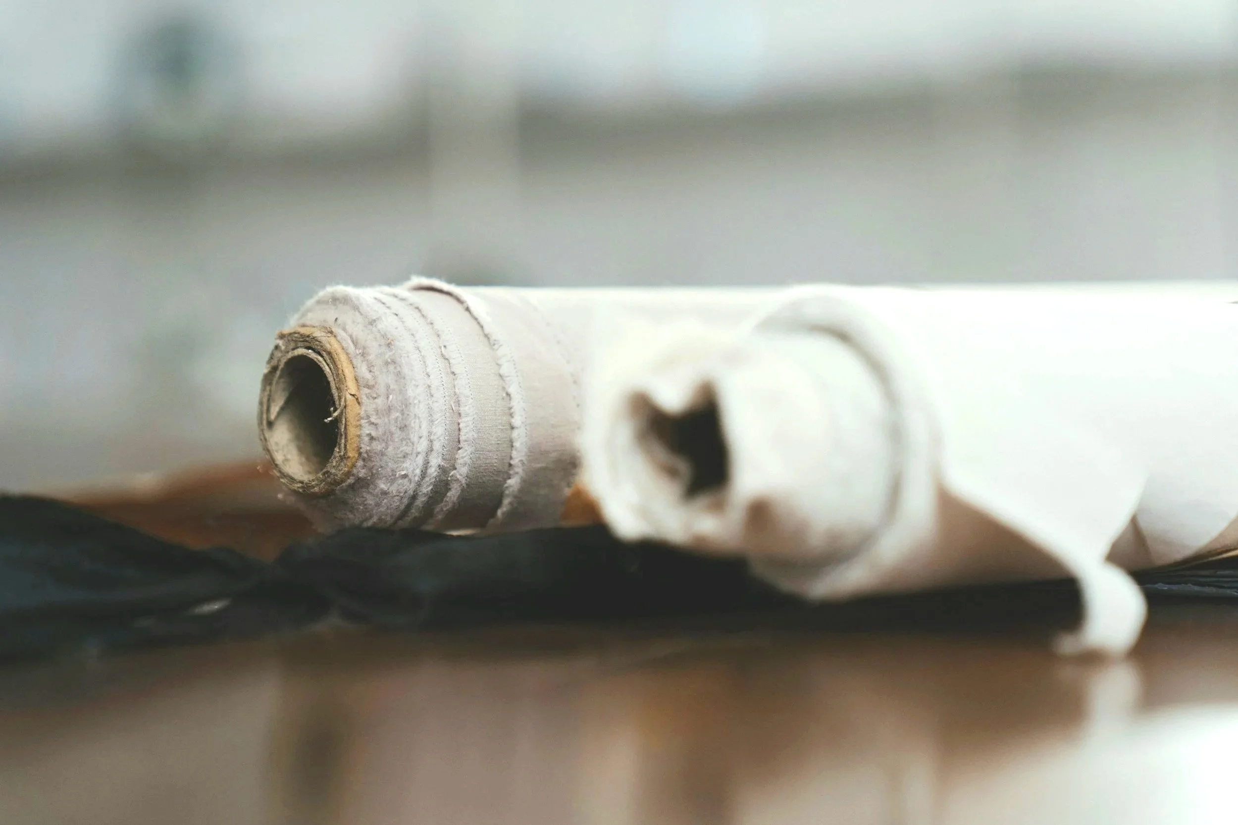 Fabric material rolls used for material selection and product development.
