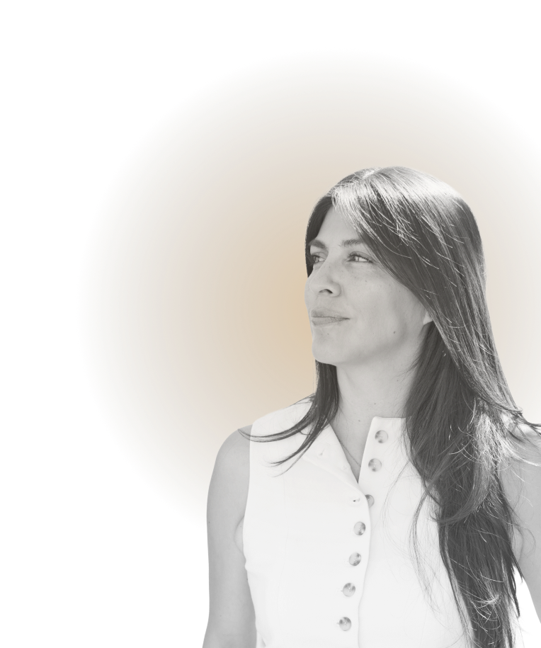 Black and white portrait of a woman with straight hair, wearing a sleeveless white top with buttons, against a gold circular background.